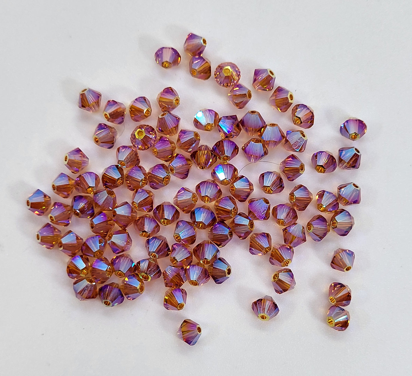 #5328 - Swarovski Crystal 4mm AB2X Bicone Beads; 24pc per pack