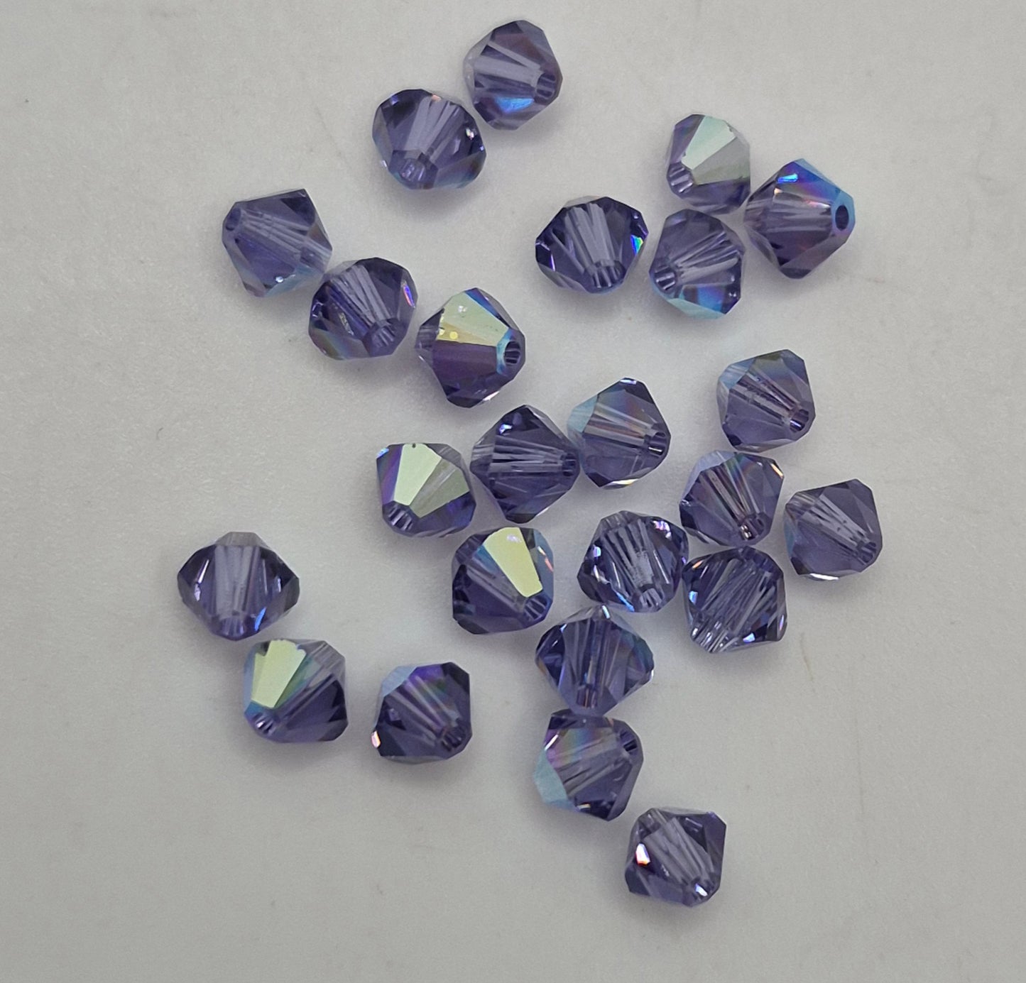 #5301 - 24pc Swarovski Crystal Tanzanite AB 4mm Bicone Beads; LAST ONE