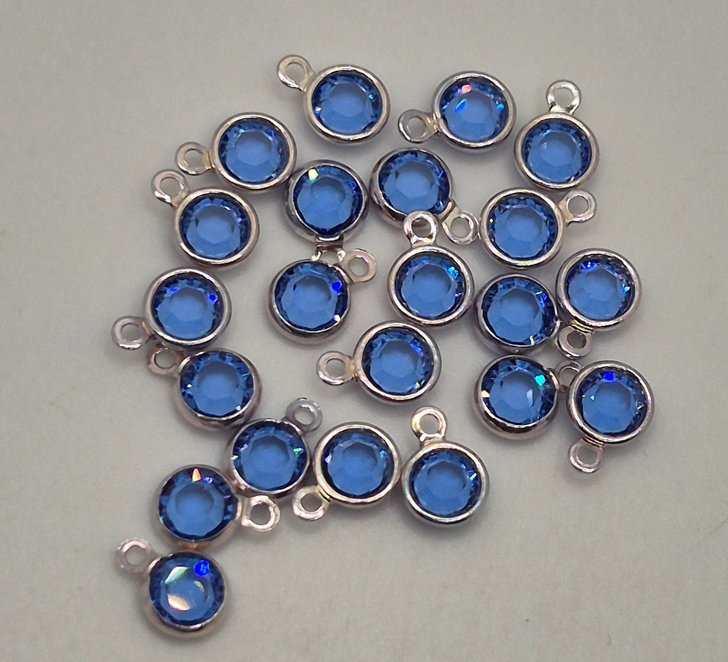 #57700 - Swarovski Crystal Sapphire Silver Plated 4mm 1 Loop Channel Charms; 12pc per pack