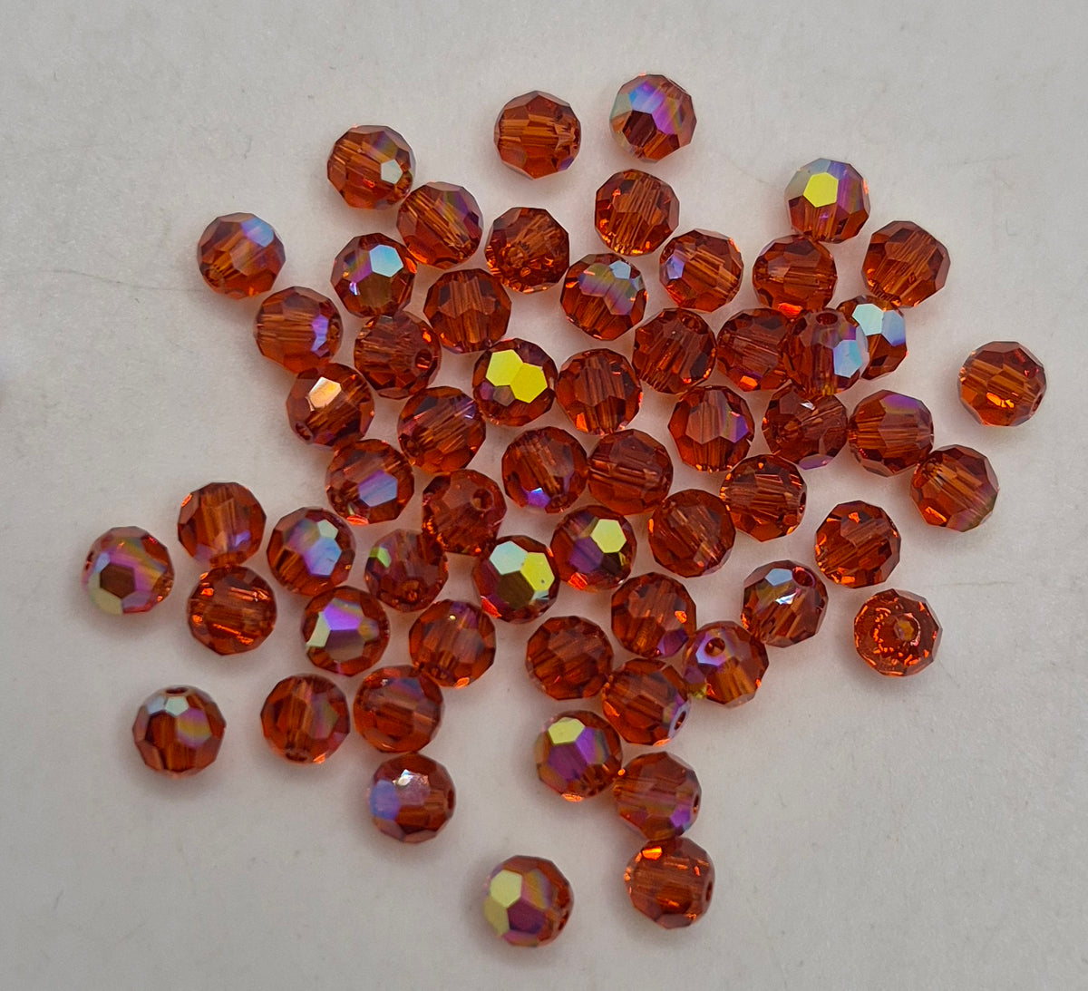 #5000 - Swarovski Crystal 4mm Round Beads w/ AB Finish; 24pc per pack
