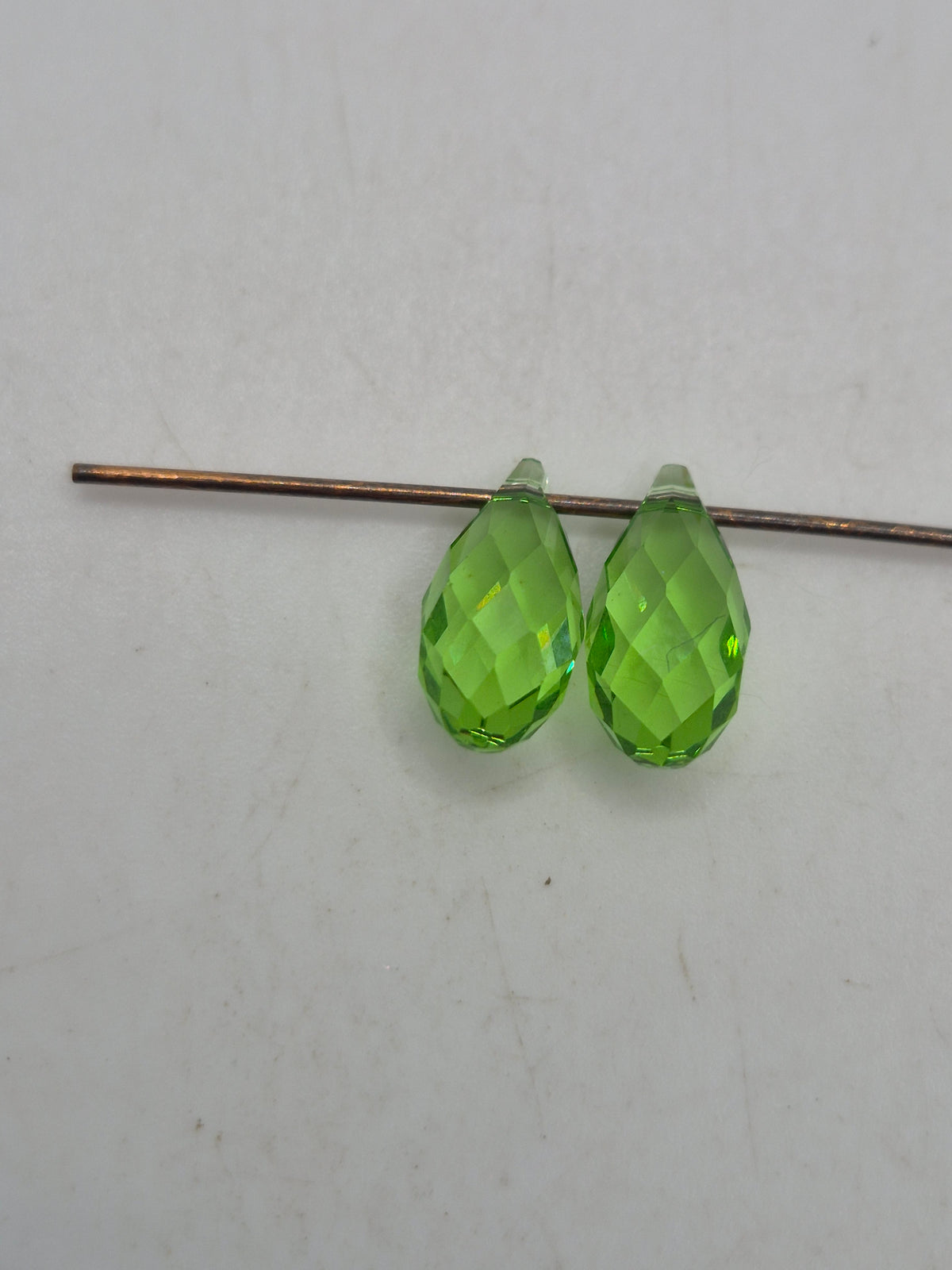 #6010 - Swarovski Crystal Peridot 11mm Briolette Pendants; 2pc per pack