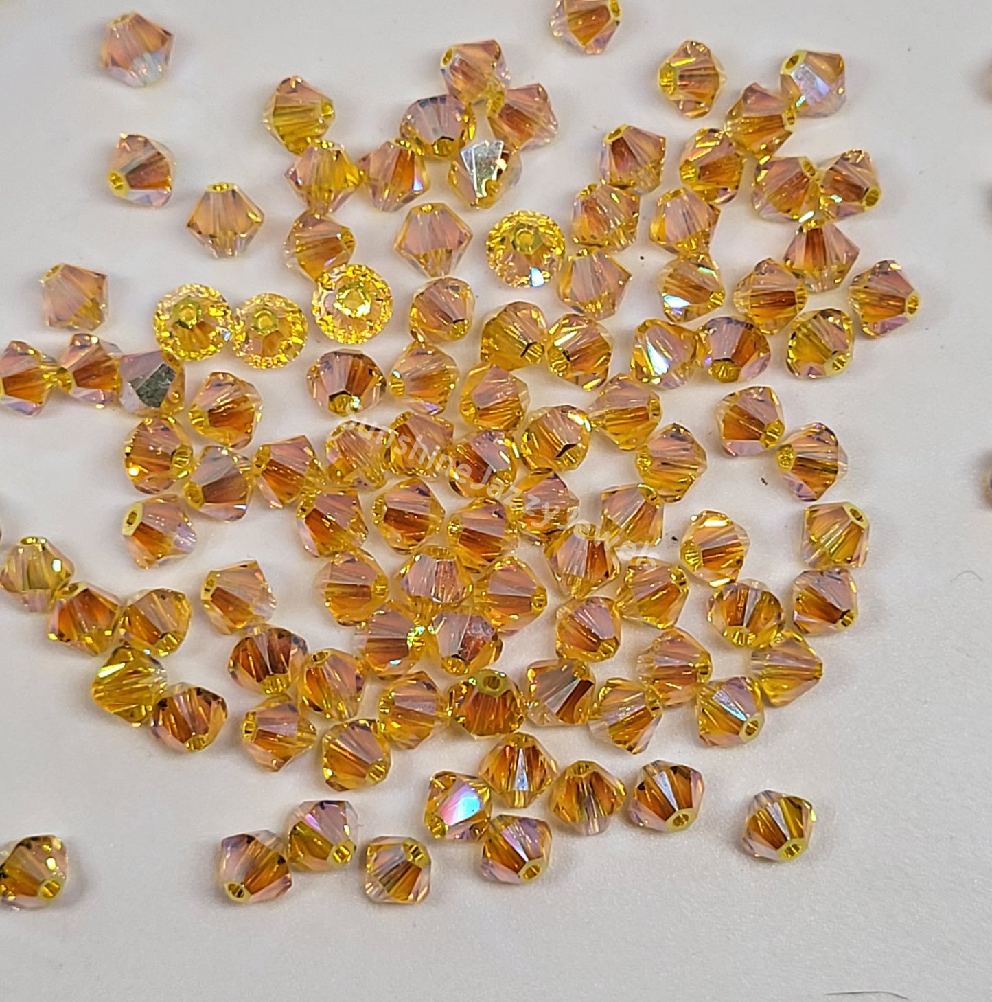 #5328 - Swarovski Crystal 4mm AB2X Bicone Beads; 24pc per pack