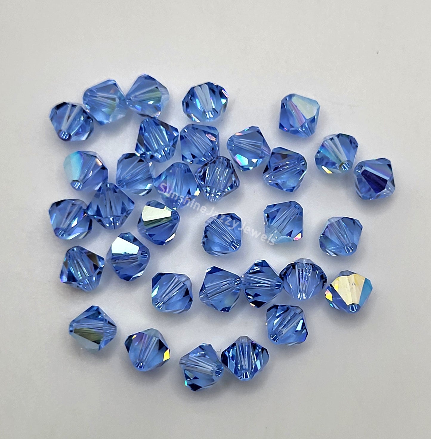 #5328 - Swarovski Crystal 6mm Bicone w/ AB Finish; 12pc per pack