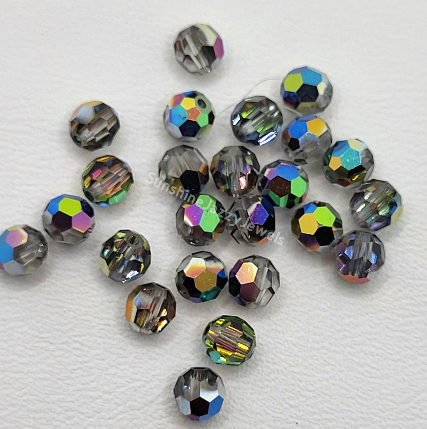 #5000 - Swarovski Crystal 4mm Faceted Round Beads w/ Crystal Effect