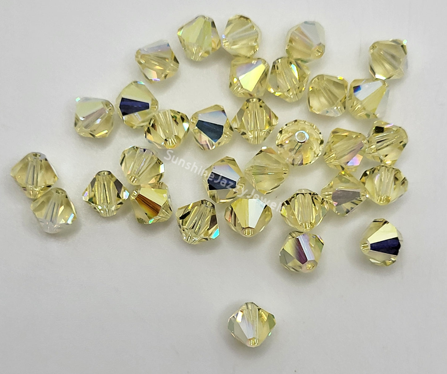 #5328 - Swarovski Crystal 6mm Bicone w/ AB Finish; 12pc per pack