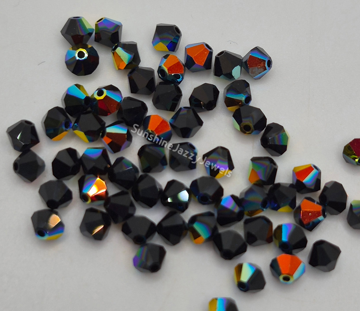 #5328 - Swarovski Crystal 4mm Bicone Beads w/ AB Finish; 24pc per pack