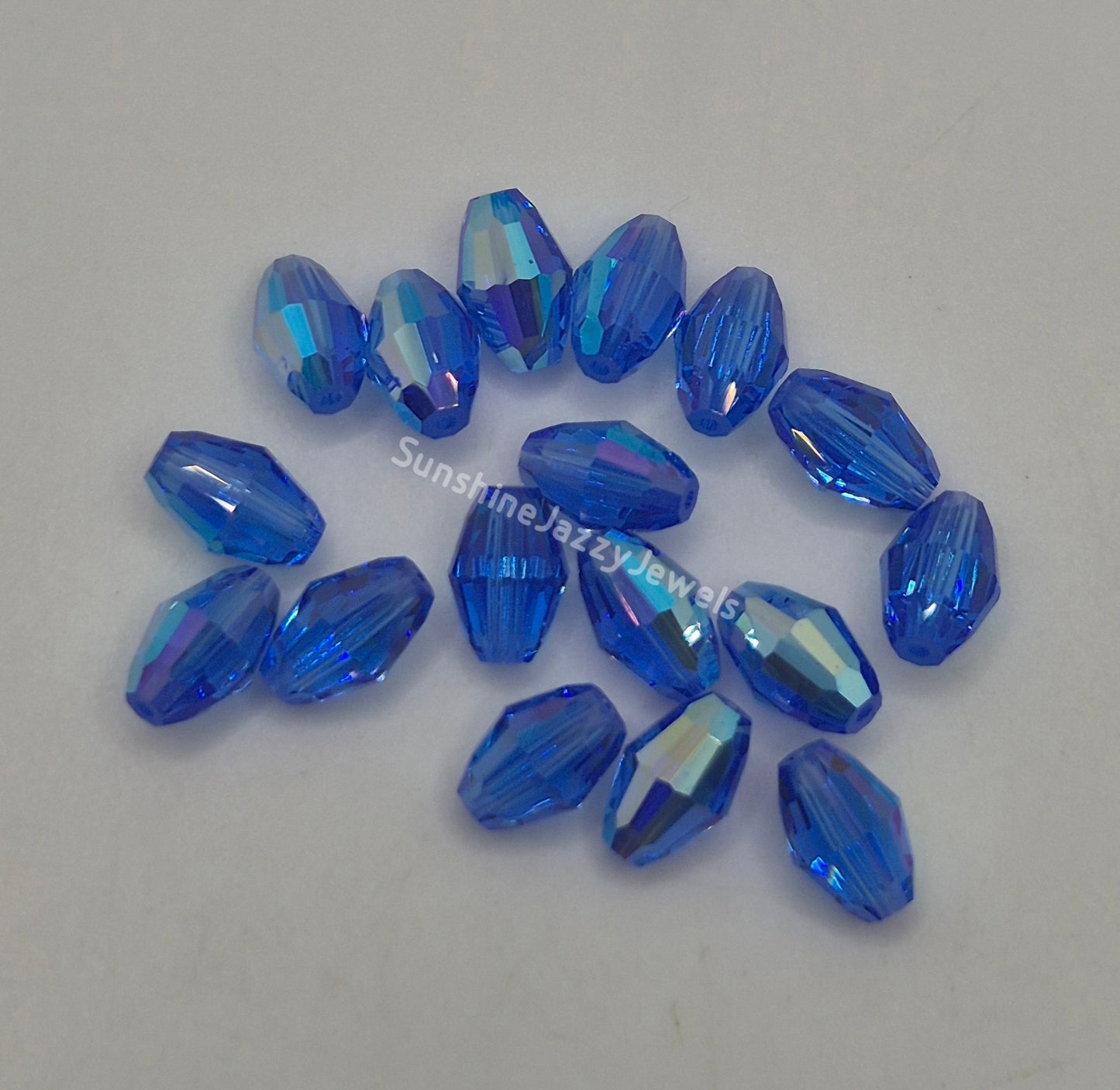 #5200 - Swarovski Crystal 9x6mm Oval Beads; AB Finish; 6pc per pack