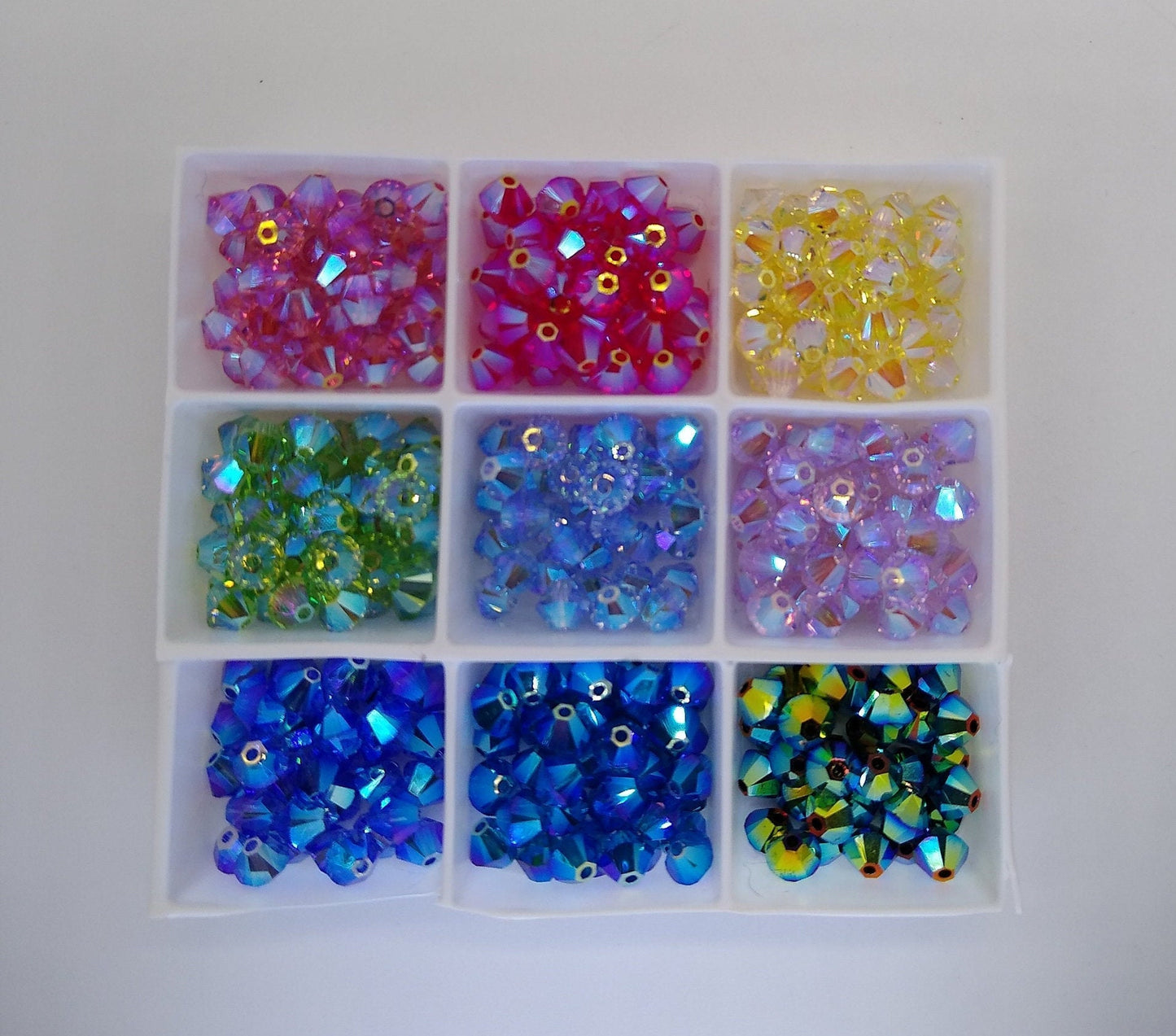 #5328 - Swarovski Crystal 4mm AB2X Bicone Beads; 24pc per pack