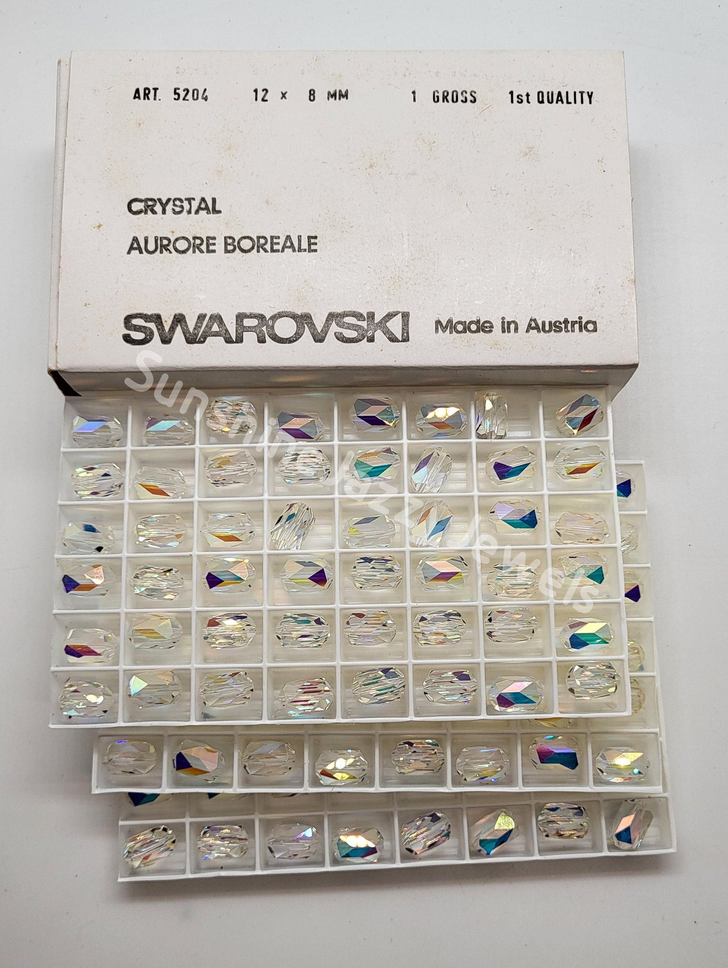 #5204 - Factory Pack Swarovski Crystal Clear AB 12x8mm Barrell Beads; 144pc