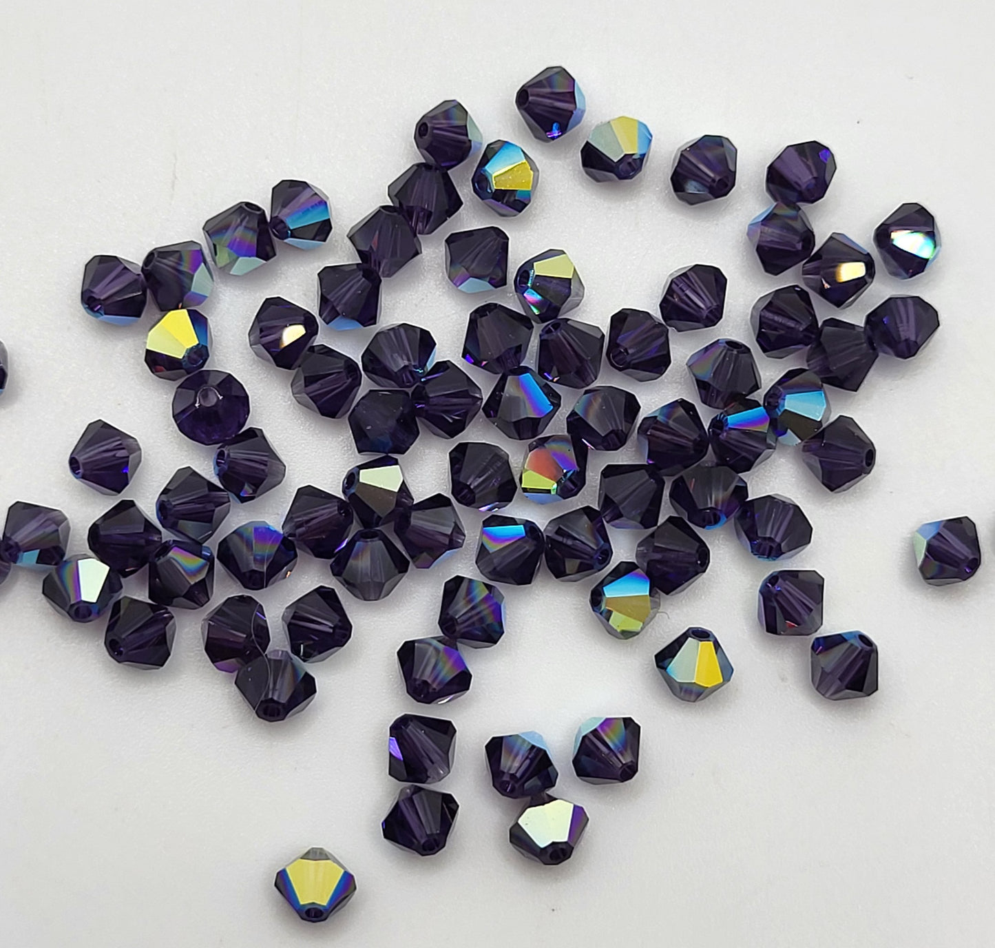 #5328 - Swarovski Crystal 4mm Bicone Beads w/ AB Finish; 24pc per pack