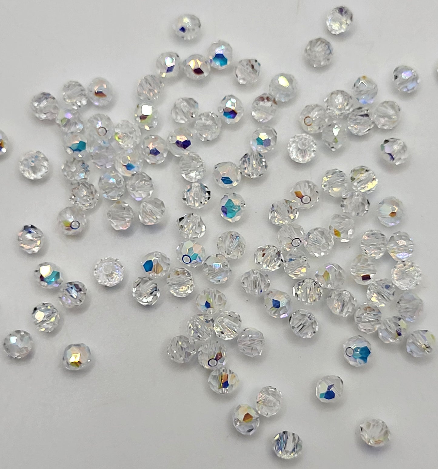 #5309/1 - Swarovski Crystal Clear AB 4mm Rounded Bicone Beads; 24pc per pack