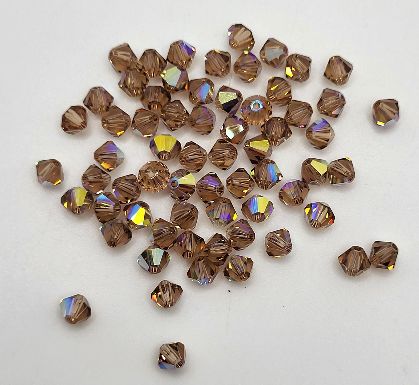 #5328 - Swarovski Crystal 4mm Bicone Beads w/ AB Finish; 24pc per pack