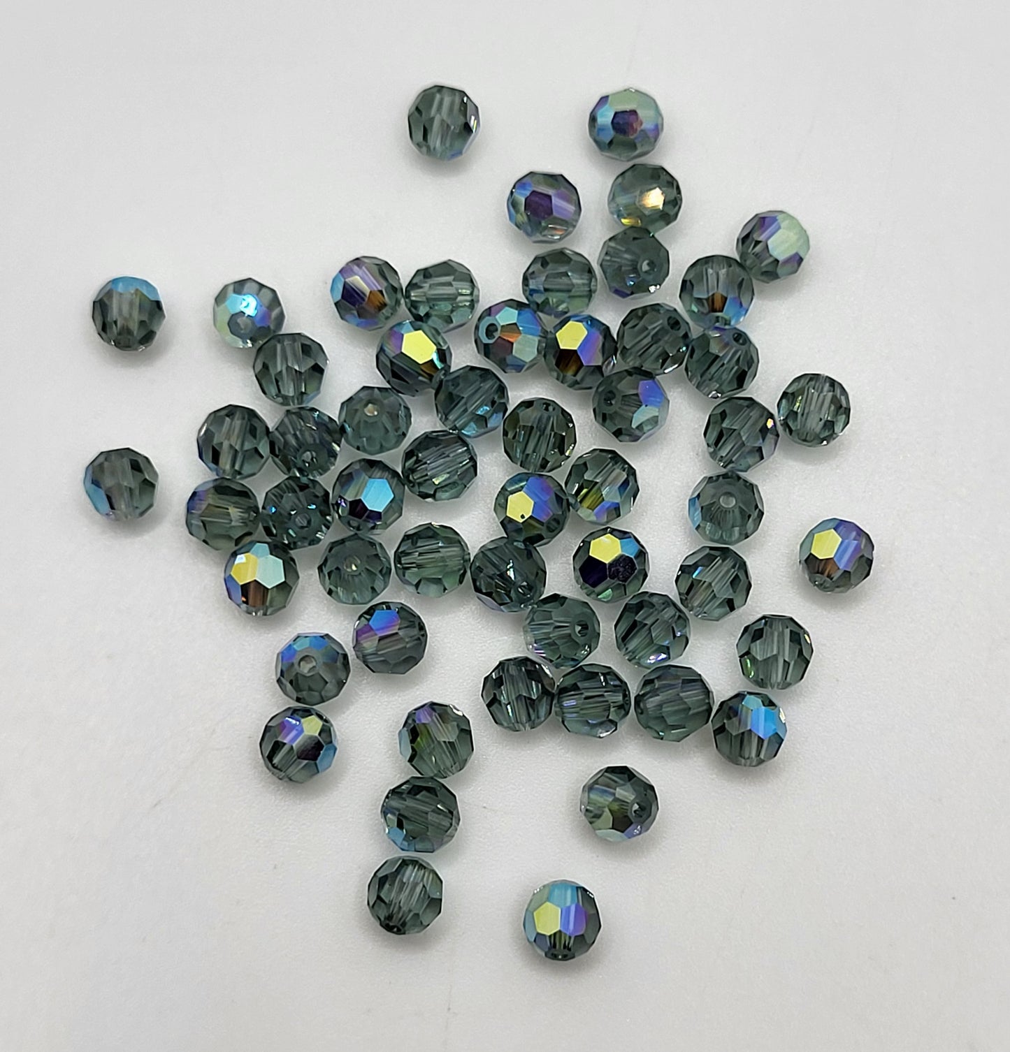 #5000 - Swarovski Crystal 4mm Round Beads w/ AB Finish; 24pc per pack