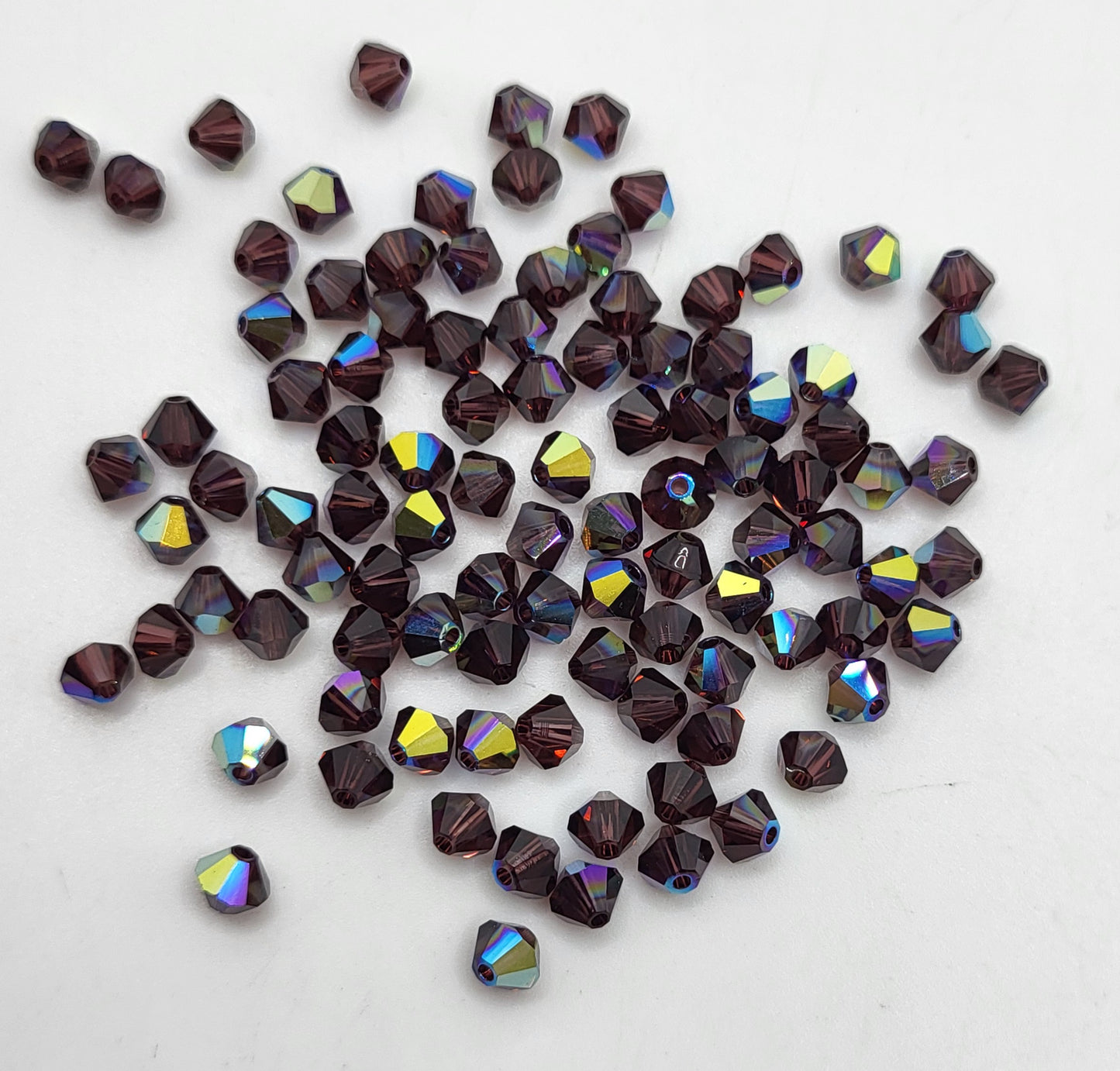 #5328 - Swarovski Crystal 4mm Bicone Beads w/ AB Finish; 24pc per pack