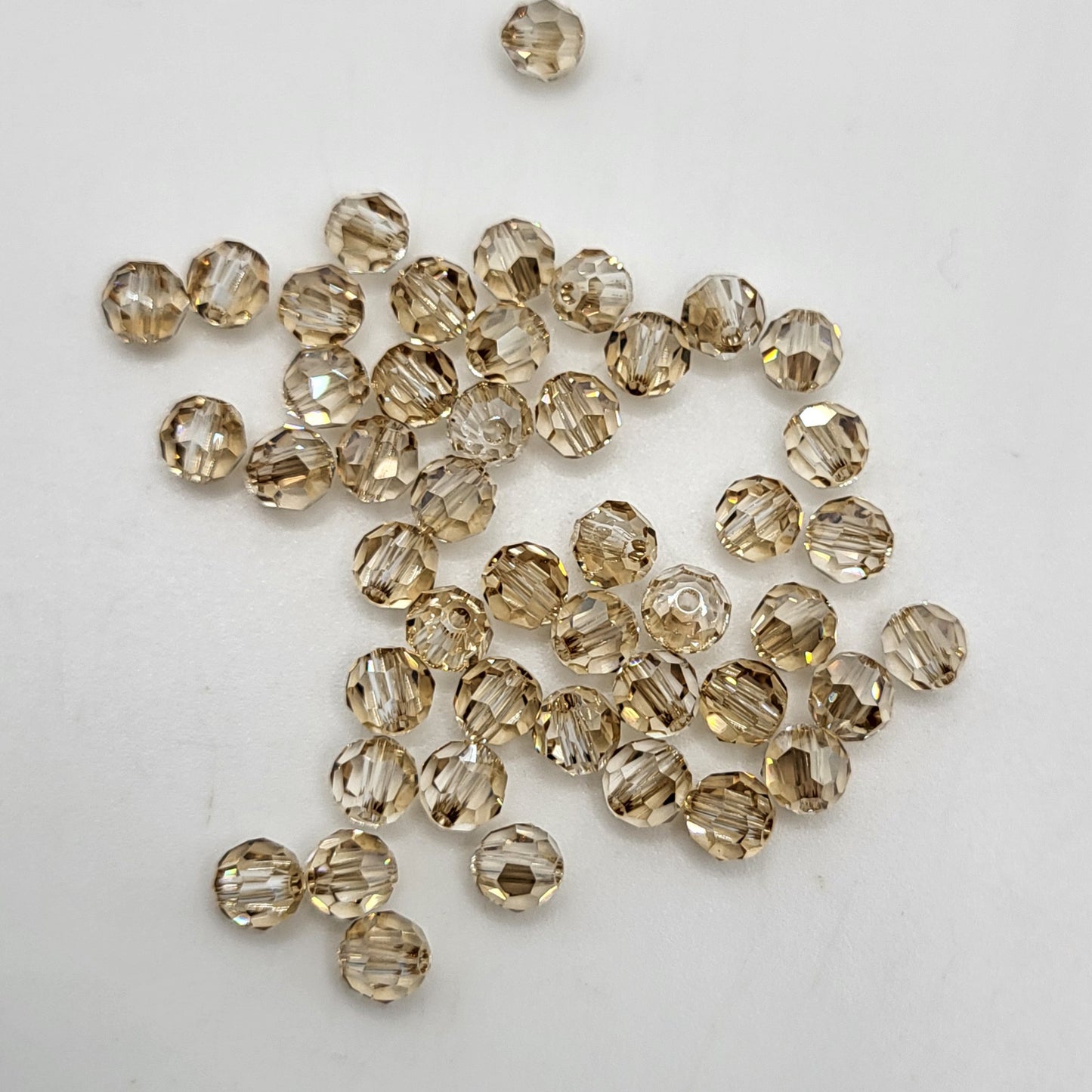 #5000 - Swarovski Crystal 4mm Faceted Round Beads w/ Crystal Effect; 24pc per pack