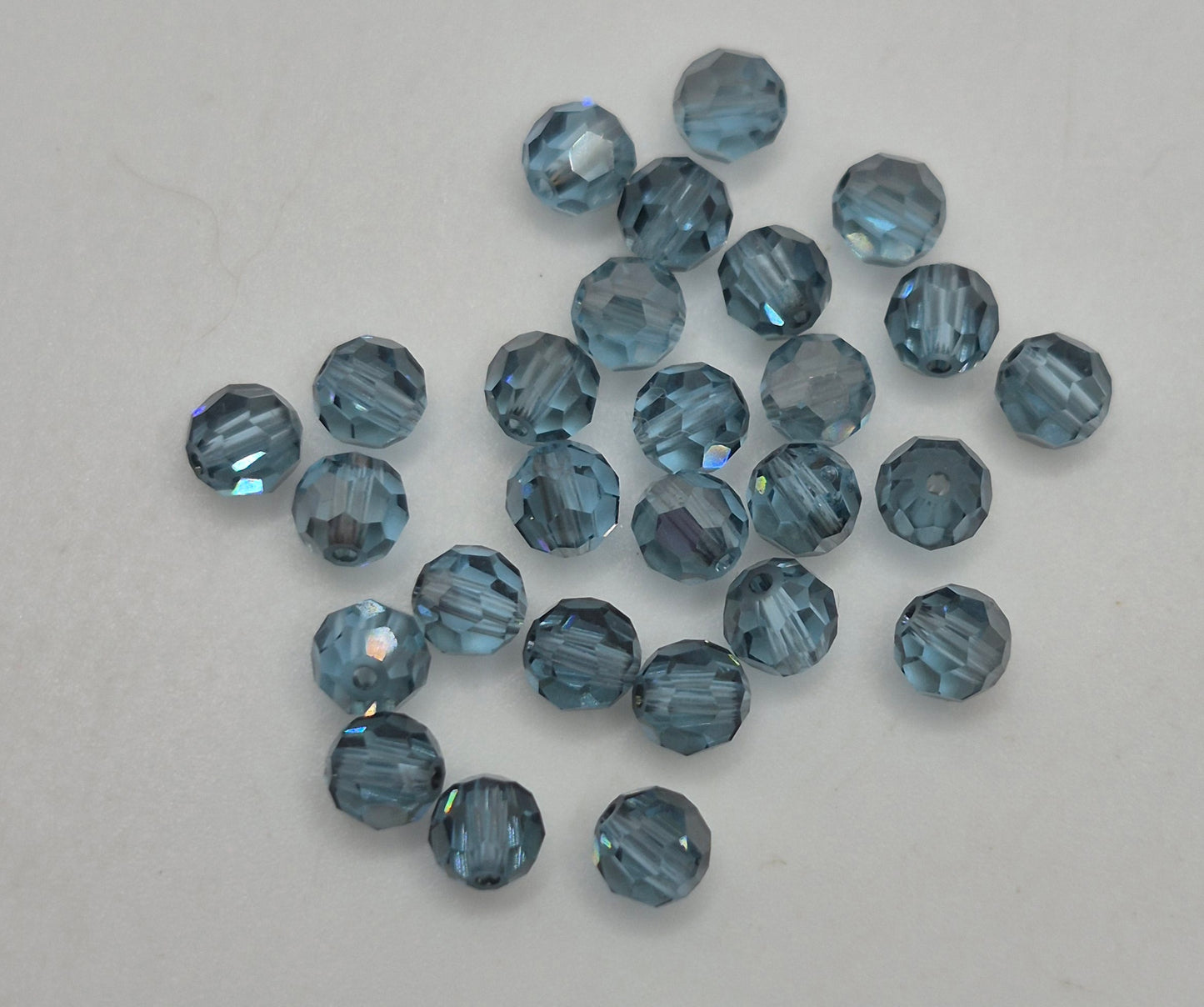 #5000 - Swarovski Crystal 4mm Faceted Round Beads w/ Satin Effect; 24pc per pack
