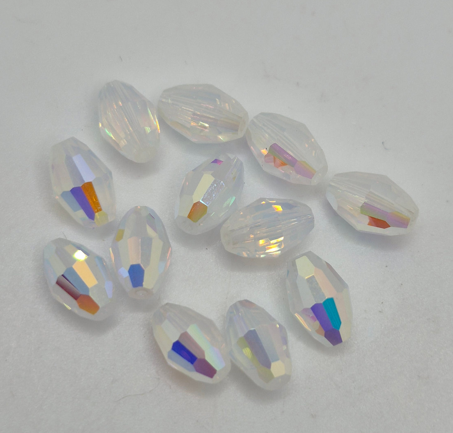 #5200 - Swarovski Crystal 9x6mm Oval Beads; AB Finish; 6pc per pack