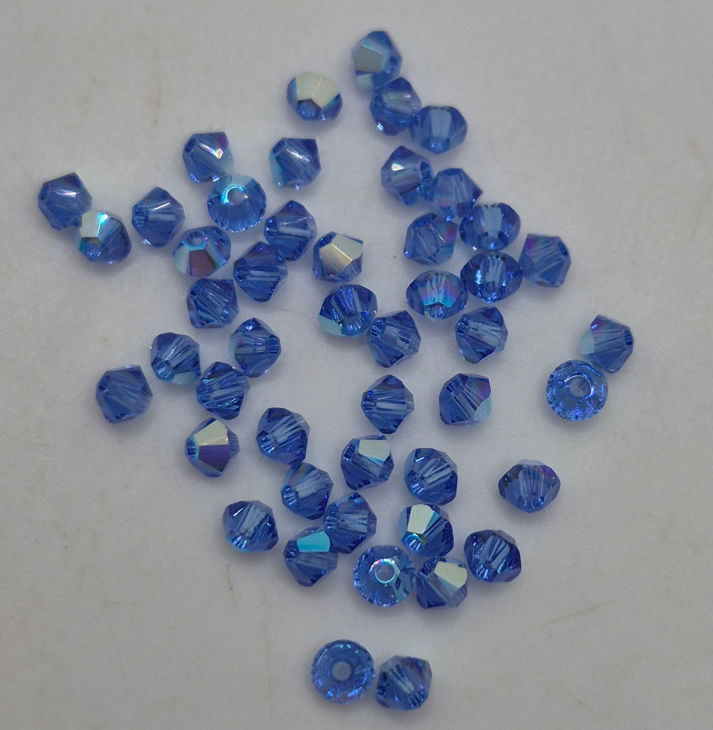 #5328 - Swarovski Crystal 3mm Bicone Beads w/ AB Finish; 24pc per pack