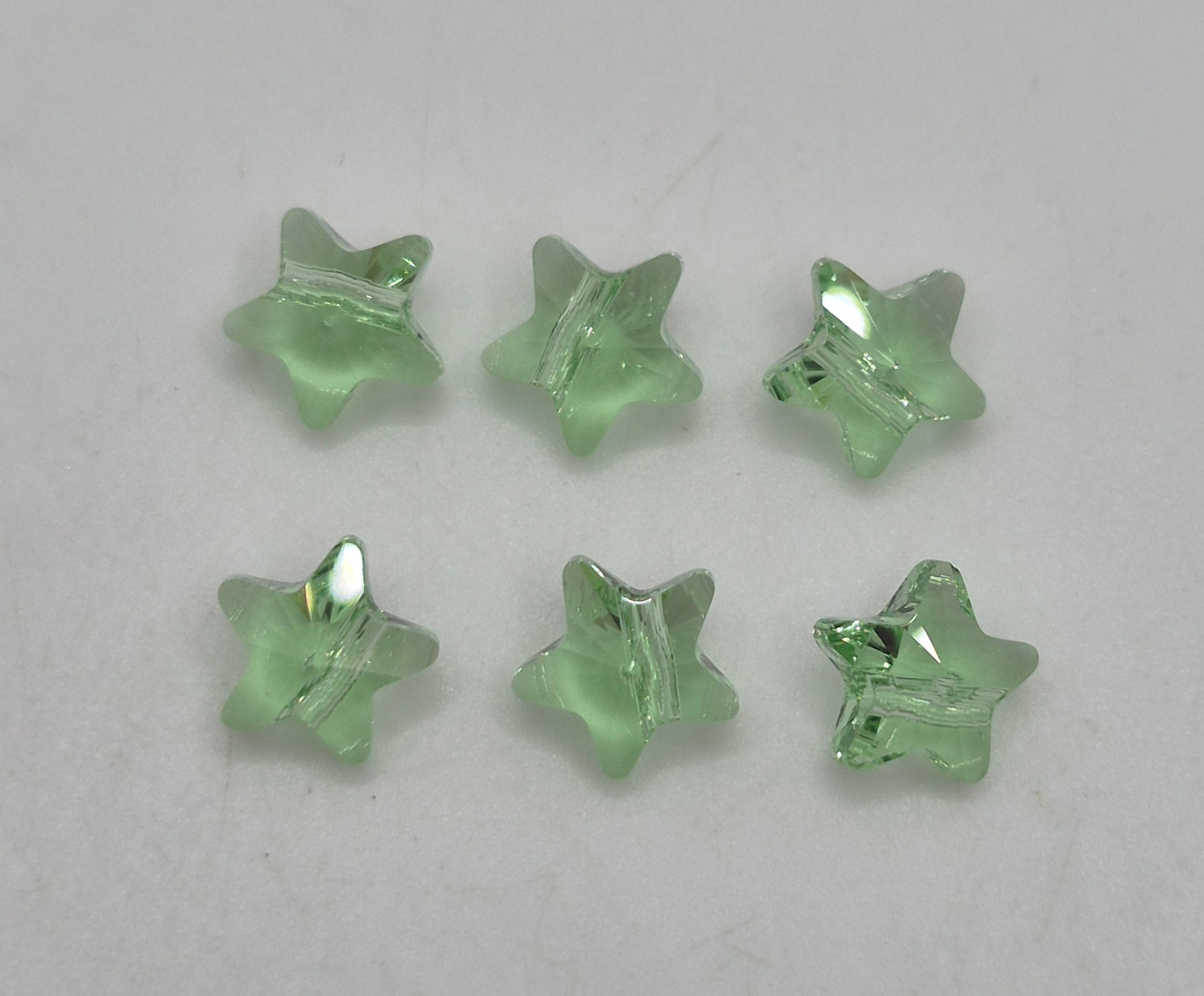 #5714 - Swarovski Crystal 8mm Peridot Star Beads; 6pc per pack