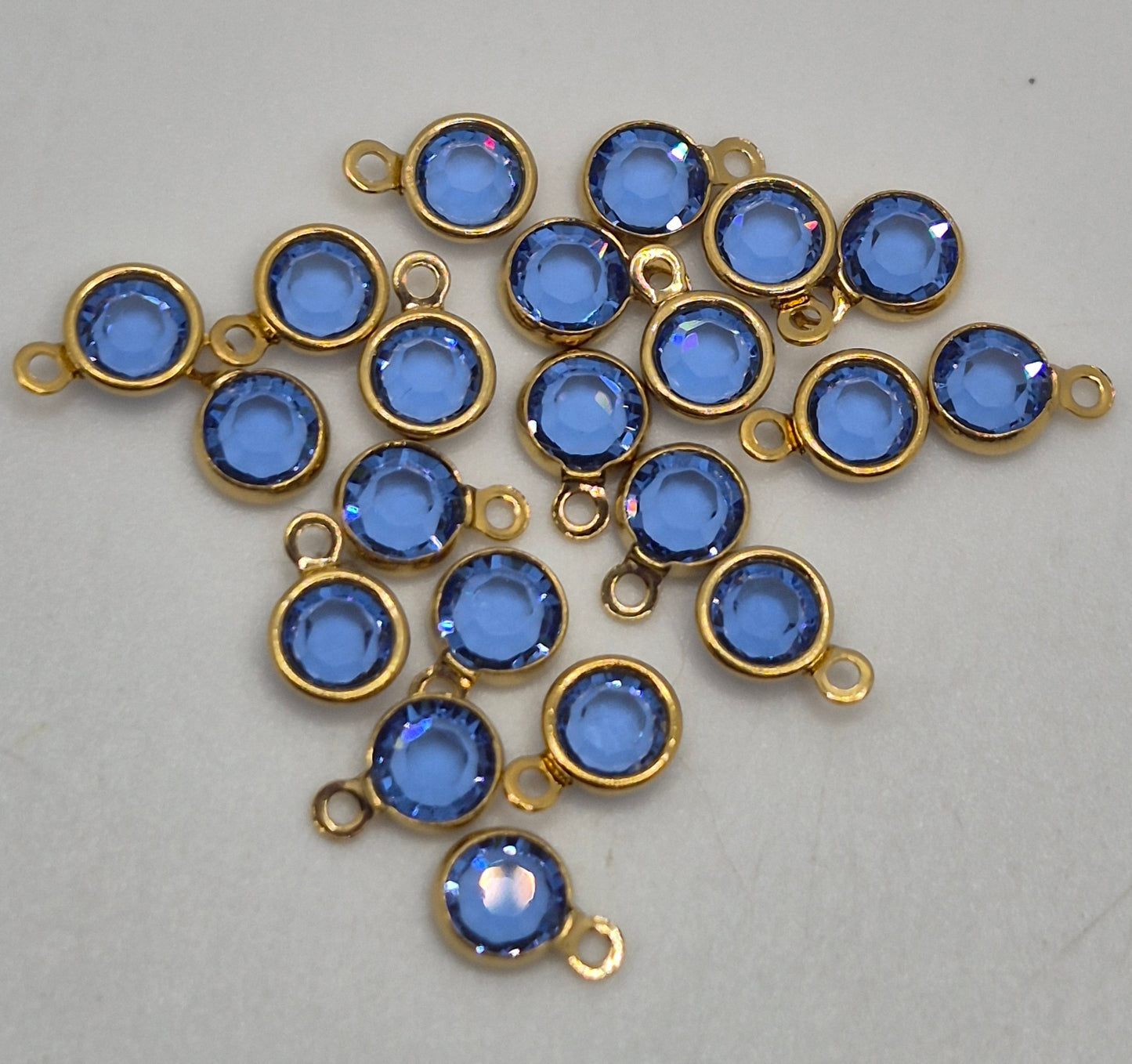 #57700 - Swarovski Crystal Sapphire Gold Plated 4mm 1 Loop Channel Charms; 12pc per pack