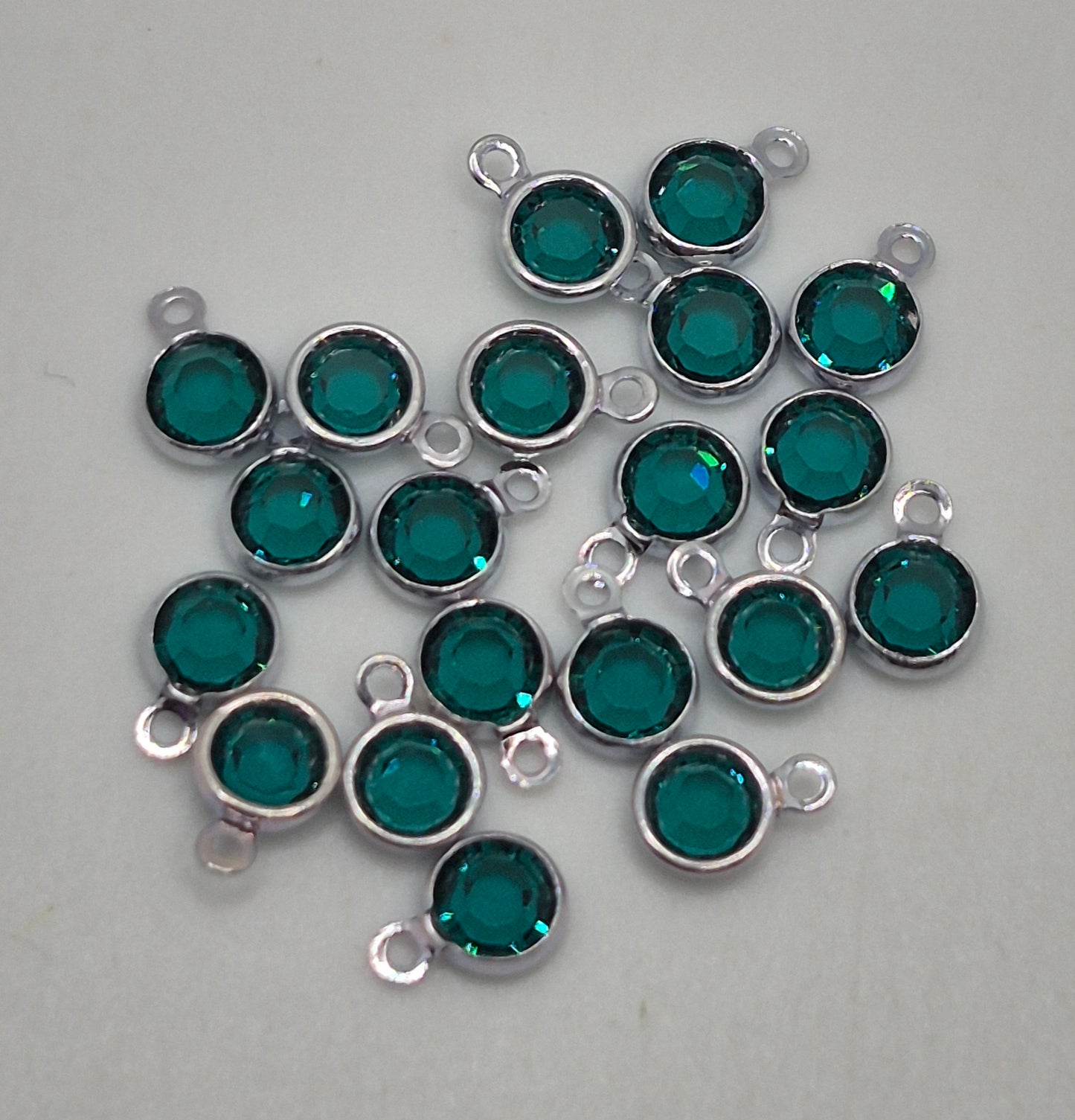 #57700 - Swarovski Crystal Emerald Silver Plated 4mm 1 Loop Channel Charms; 12pc per pack