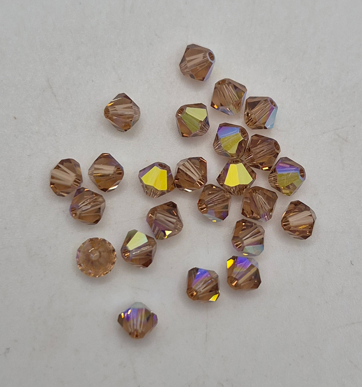 #5328 - Swarovski Crystal 3mm Bicone Beads w/ AB Finish; 24pc per pack