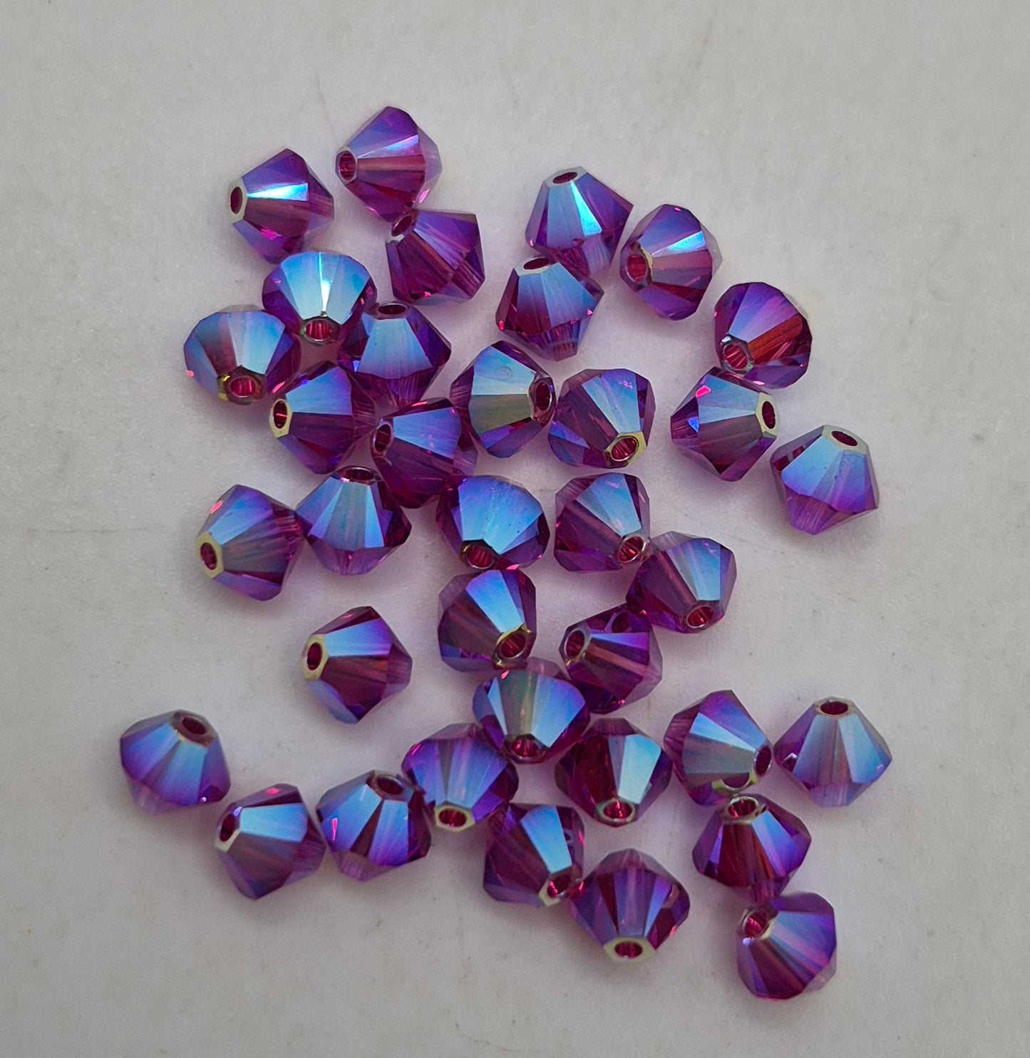 #5328 - Swarovski Crystal 4mm AB2X Bicone Beads; 24pc per pack