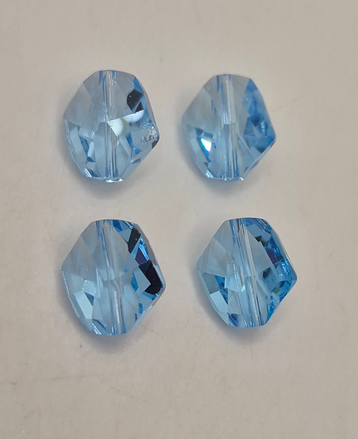 #5523 - Swarovski Crystal Aquamarine 12mm Cosmic Beads; 4pc per pack