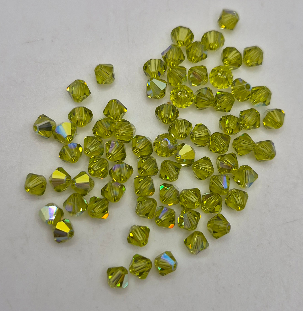 #5328 - Swarovski Crystal 4mm Bicone Beads w/ AB Finish; 24pc per pack