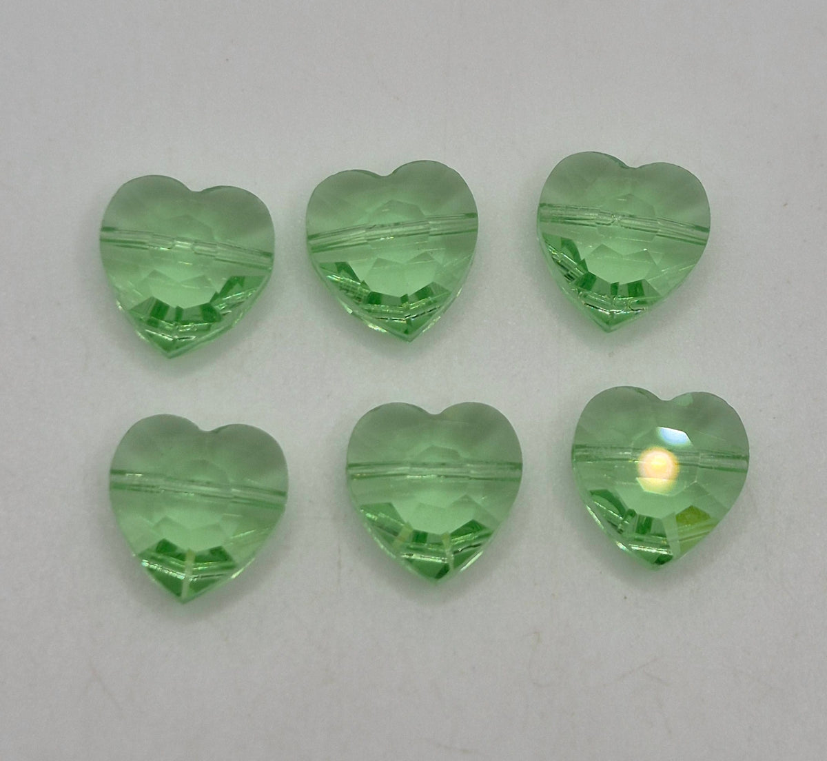 #5130 - Swarovski Crystal Peridot 10mm Heart Beads; 6pc per pack