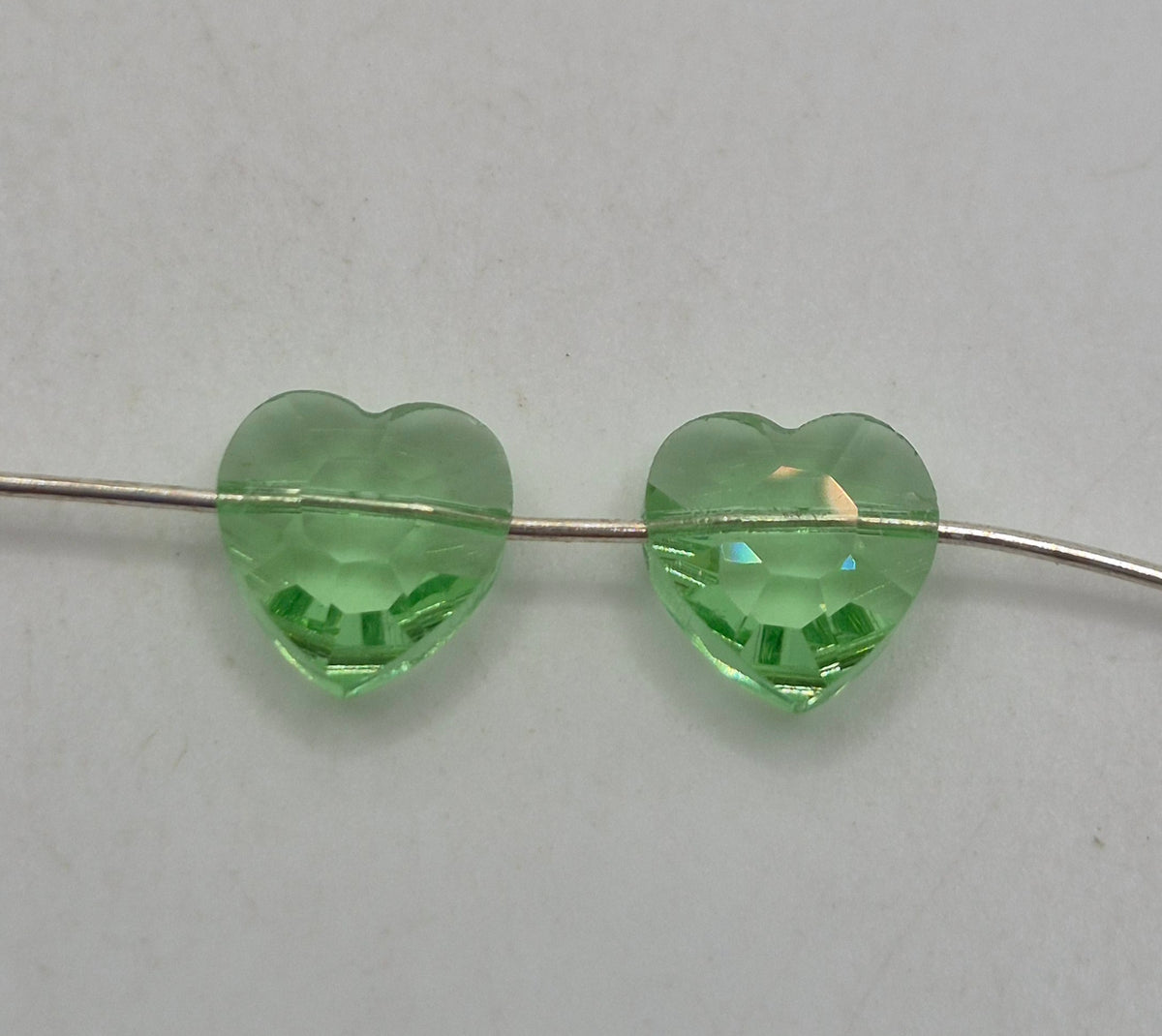 #5130 - Swarovski Crystal Peridot 10mm Heart Beads; 6pc per pack