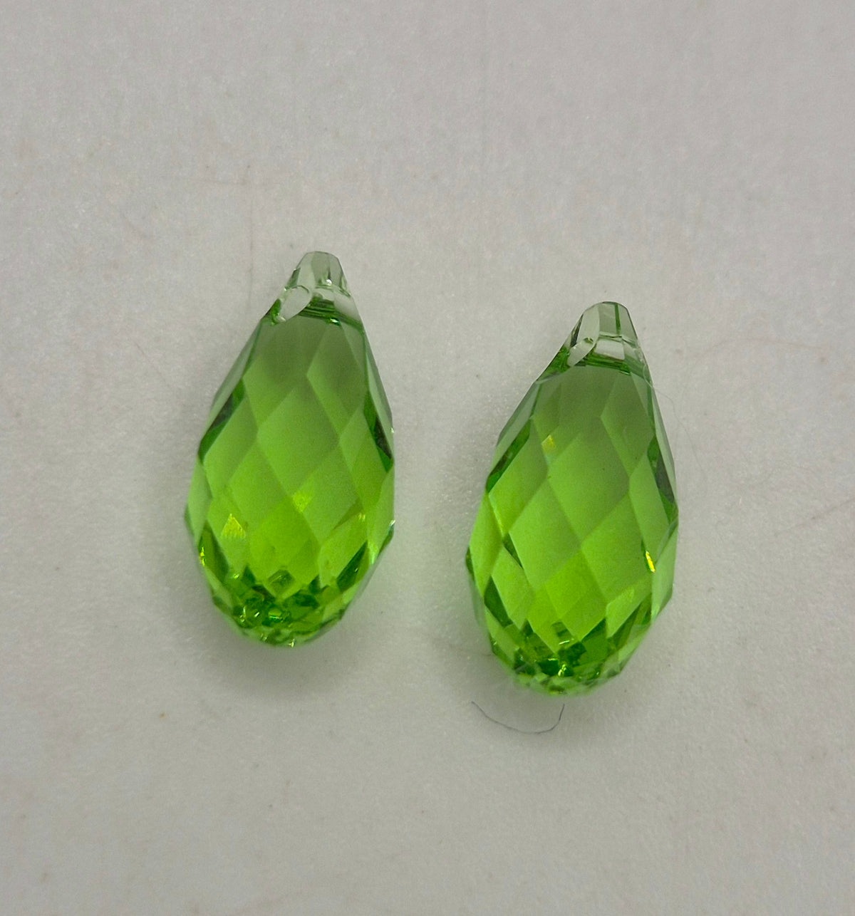 #6010 - Swarovski Crystal Peridot 11mm Briolette Pendants; 2pc per pack