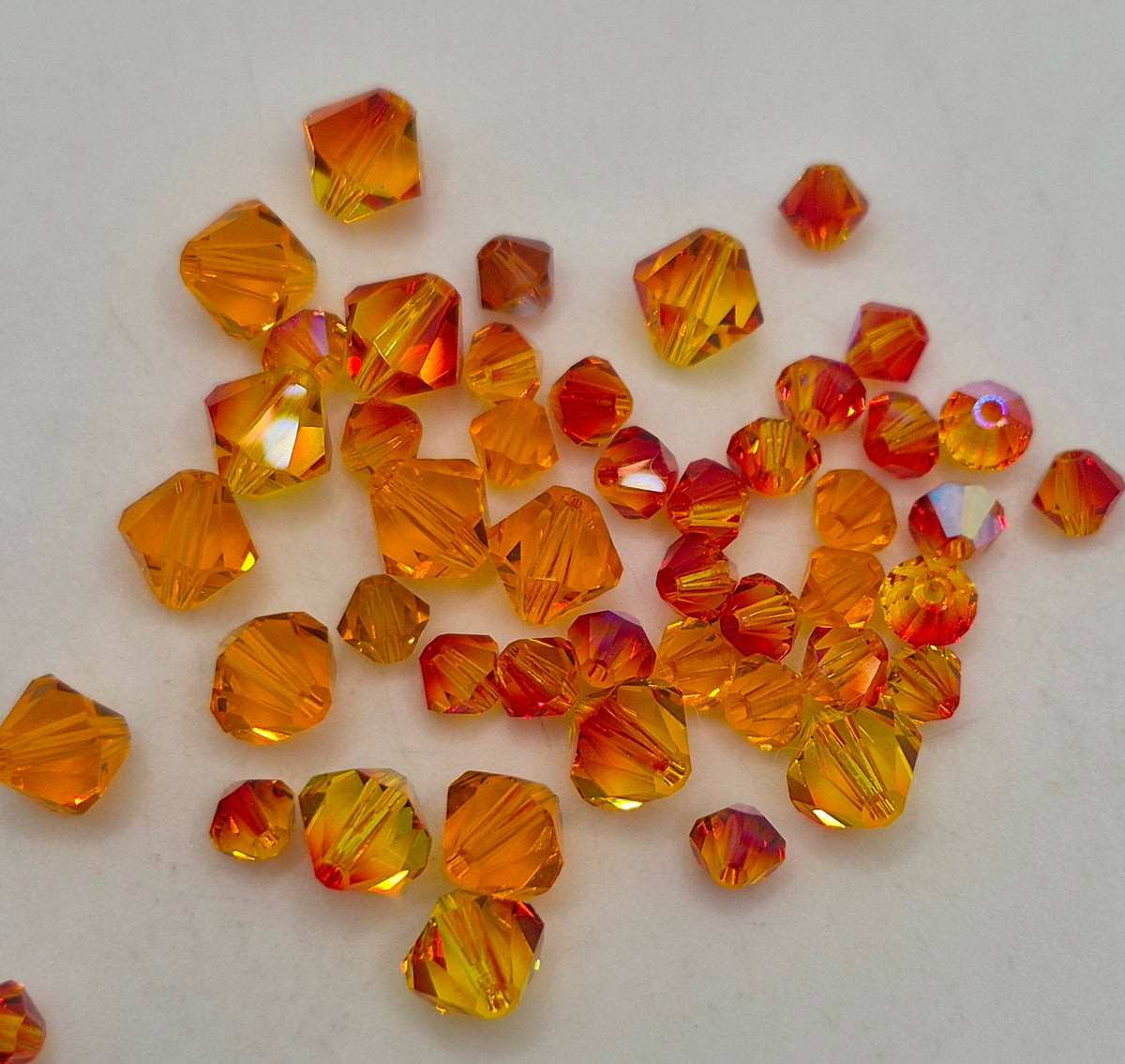 CLEARANCE MIX!  47pc Swarovski Crystal Fire Opal/ Sun 4-6mm Bicone Beads