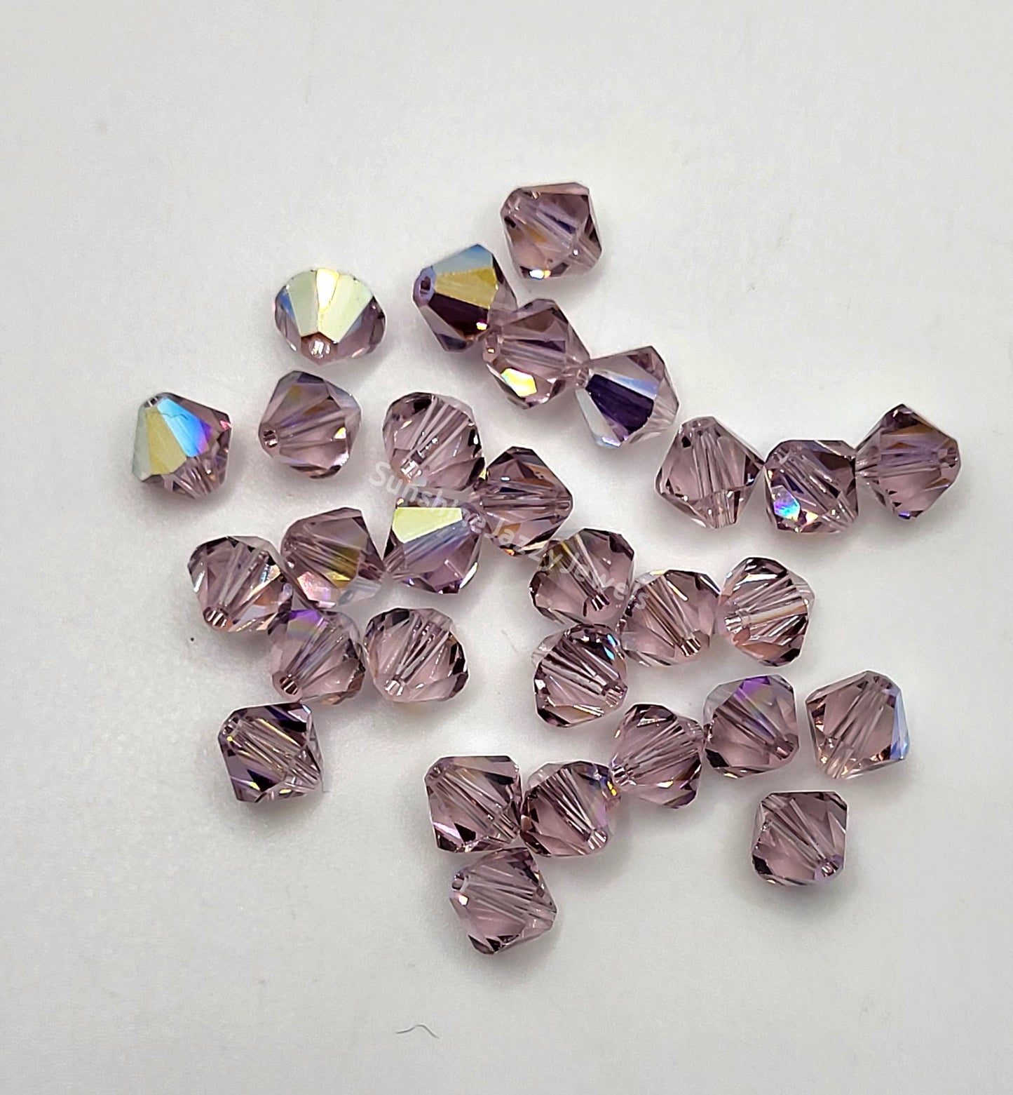 #5328 - Swarovski Crystal 4mm Bicone Beads w/ AB Finish
