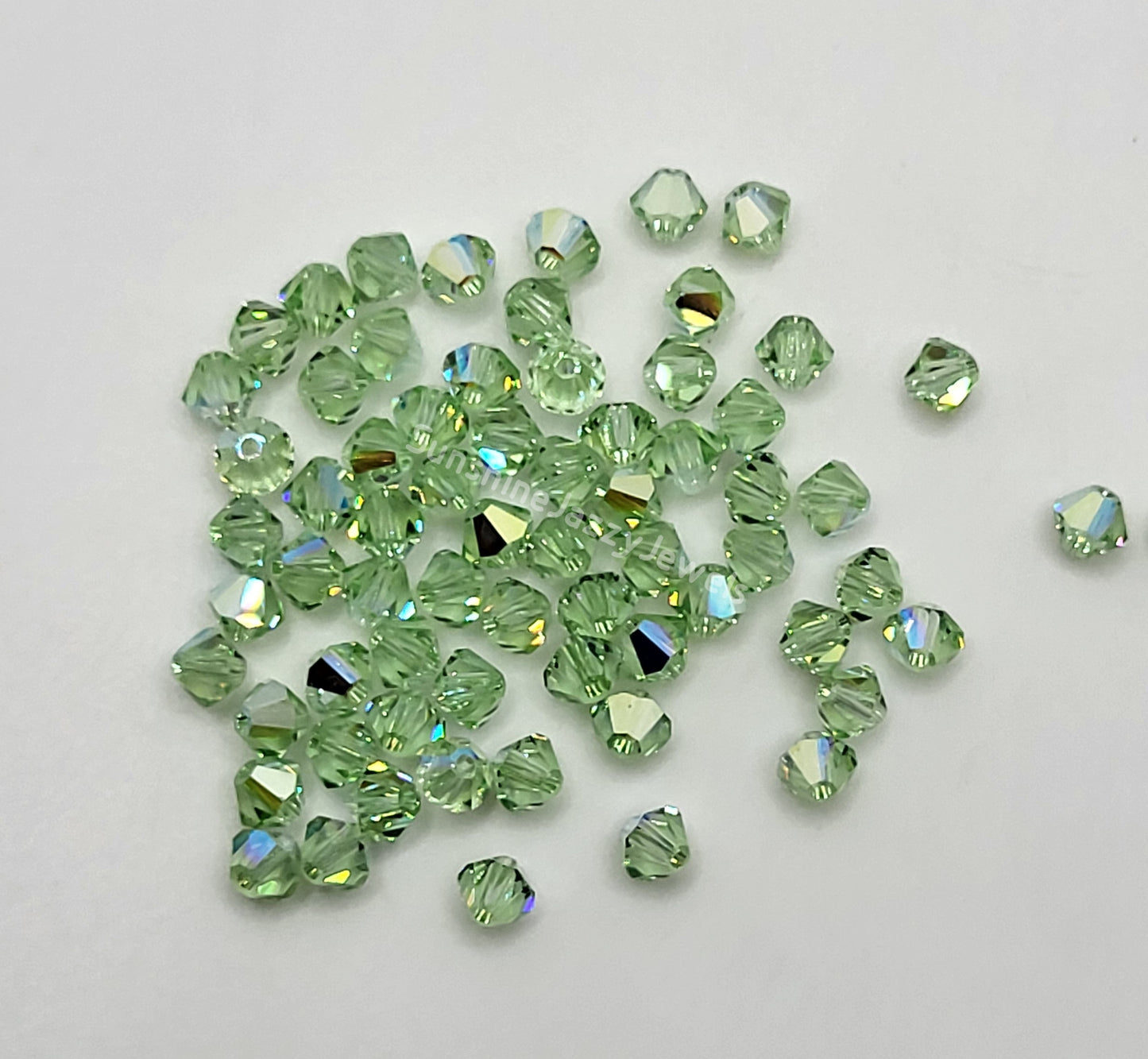 #5328 - Swarovski Crystal 4mm Bicone Beads w/ AB Finish