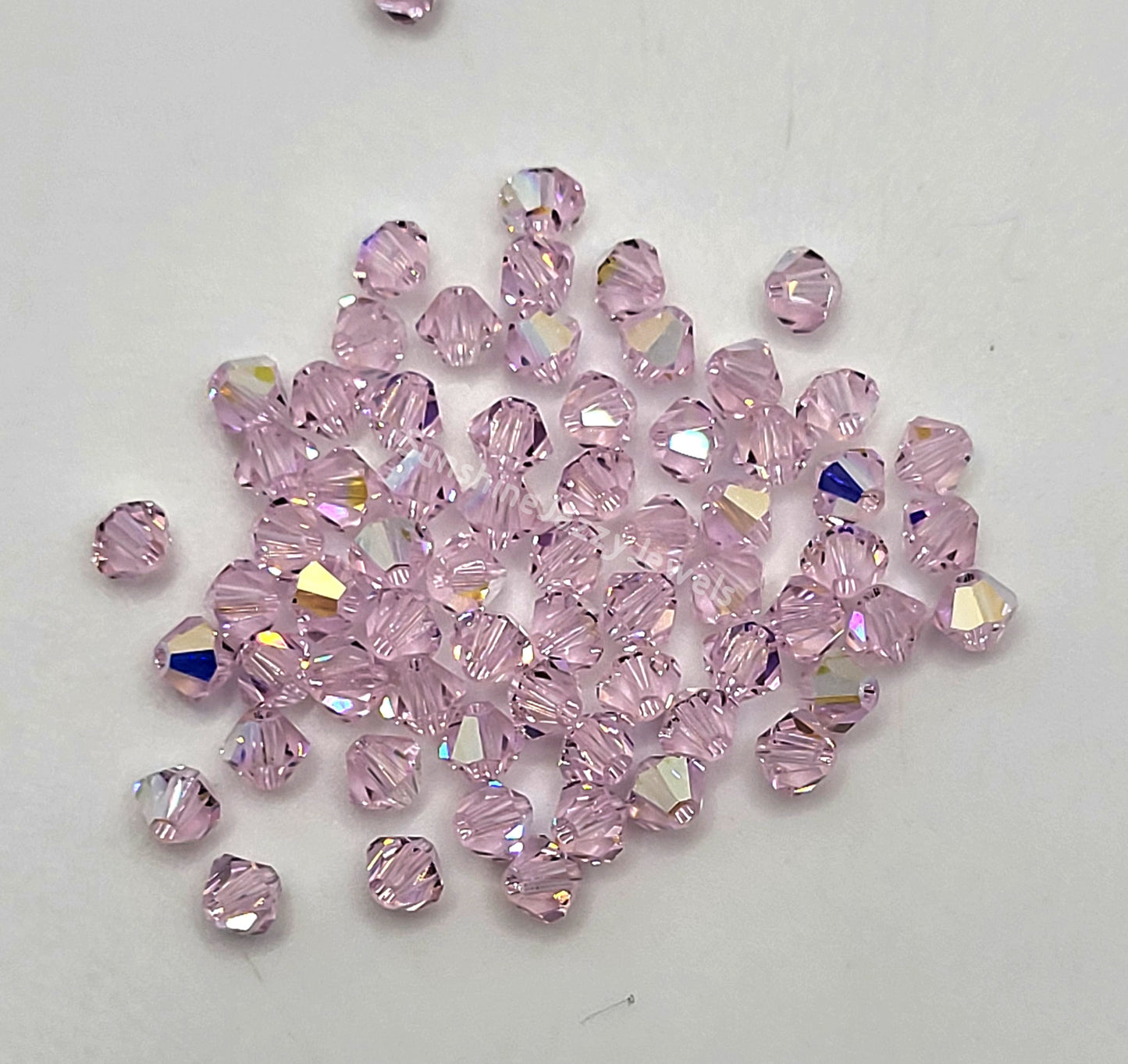 #5328 - Swarovski Crystal 4mm Bicone Beads w/ AB Finish