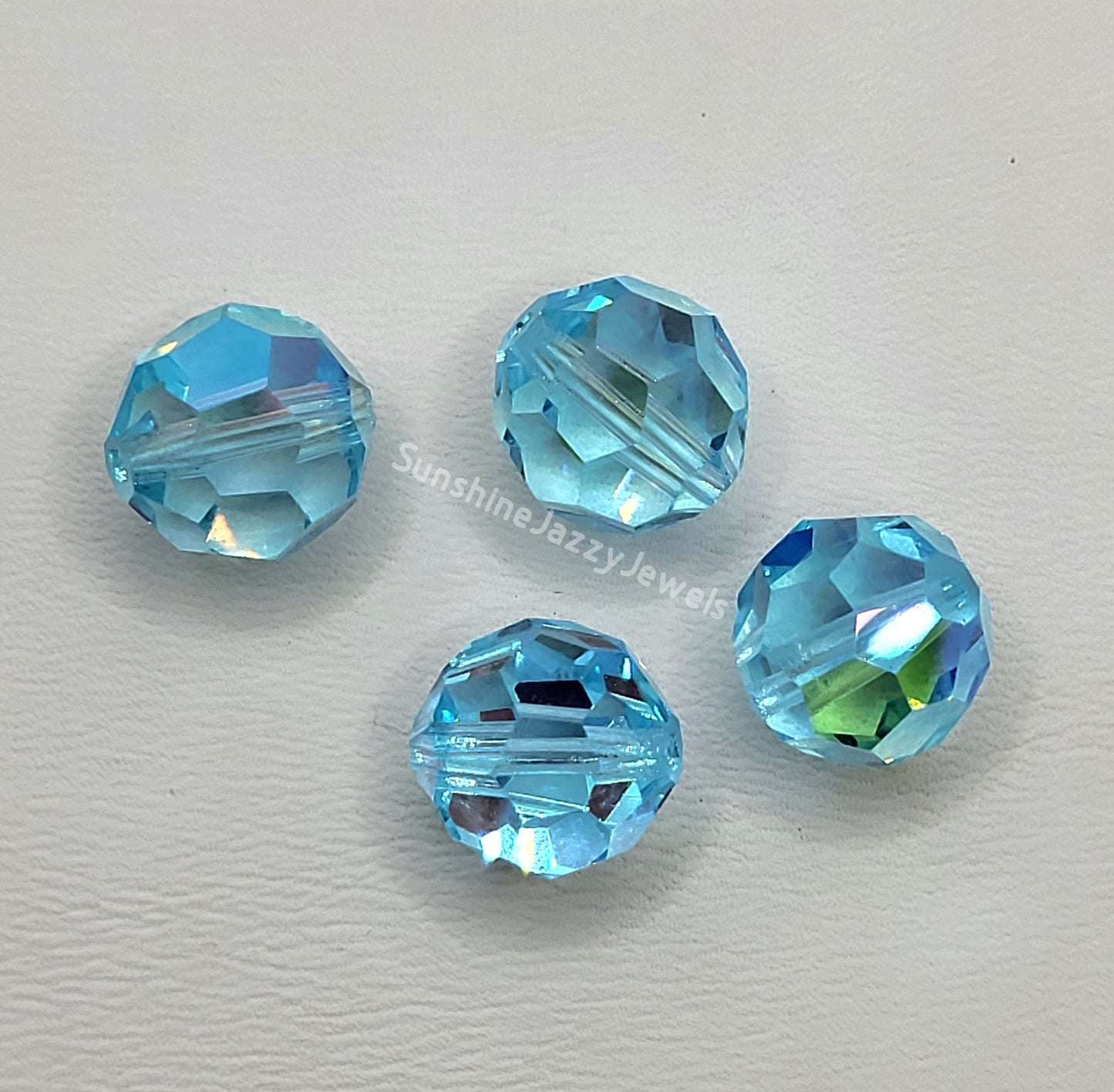 #5000 - Swarovski Crystal 12mm Faceted Round Beads w/ AB Finish