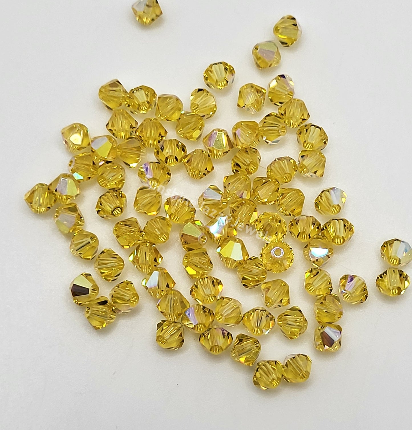 #5328 - Swarovski Crystal 4mm Bicone Beads w/ AB Finish; 24pc per pack