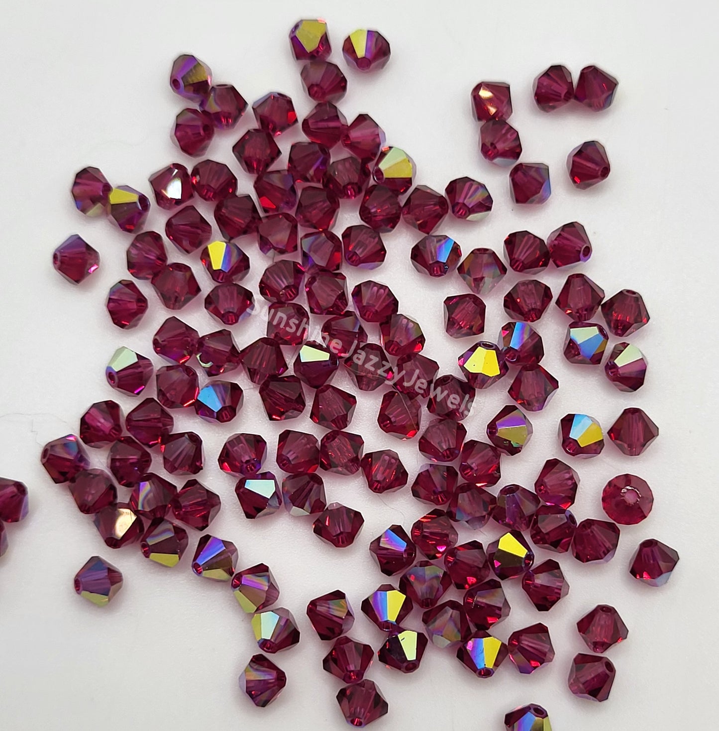 #5328 - Swarovski Crystal 4mm Bicone Beads w/ AB Finish; 24pc per pack