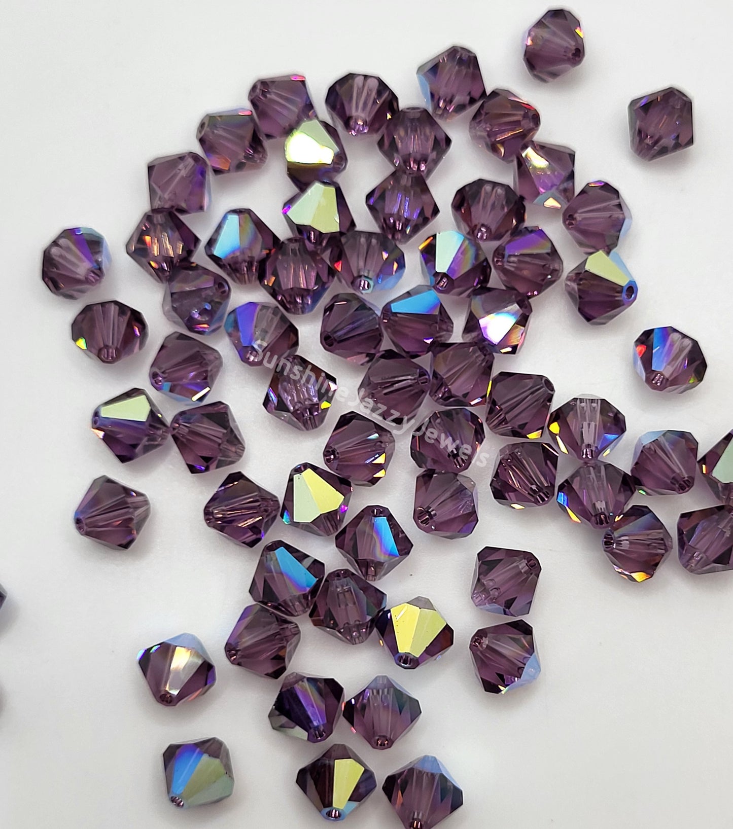 #5328 - Swarovski Crystal 4mm Bicone Beads w/ AB Finish; 24pc per pack