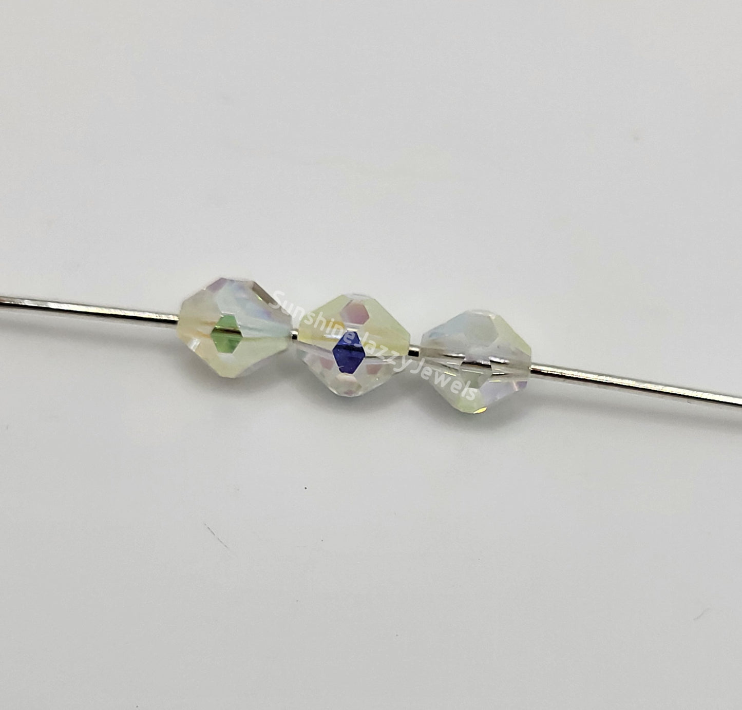 #5304 - Swarovski Crystal Clear AB2X 6mm Rounded Bicone Beads; 12pc per pack