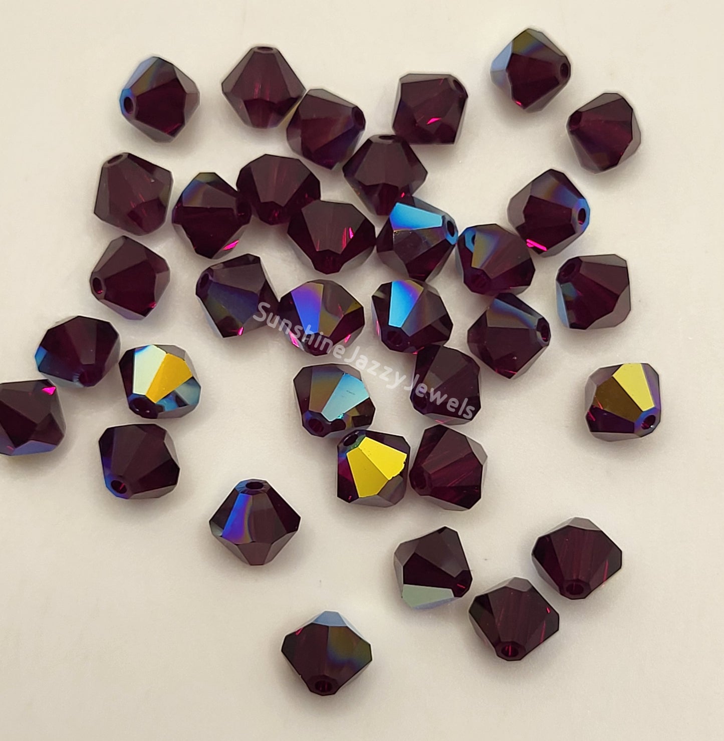 #5328 - Swarovski Crystal 4mm Bicone Beads w/ AB Finish; 24pc per pack