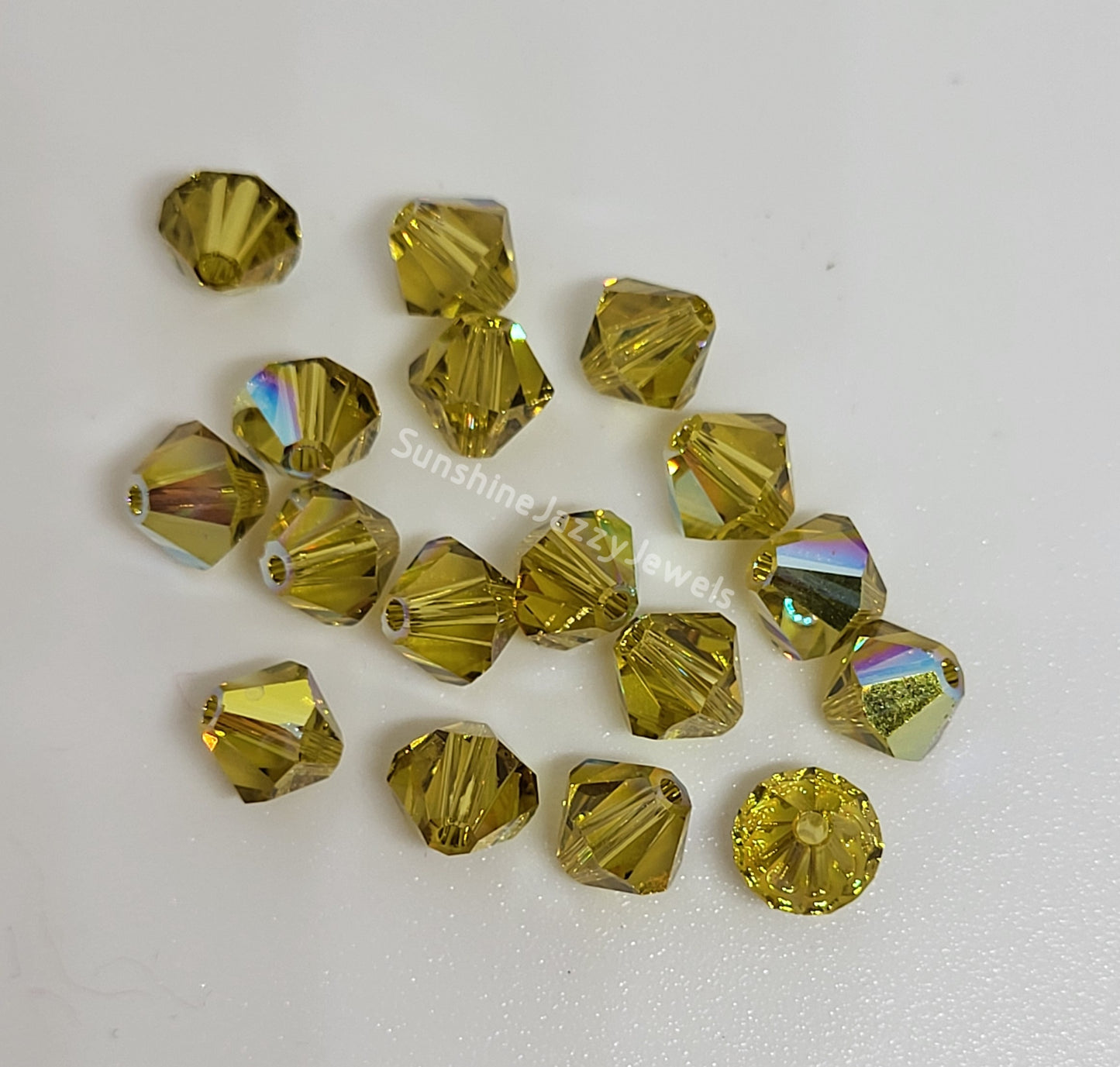 #5328 - Swarovski Crystal 4mm Bicone Beads w/ AB Finish; 24pc per pack