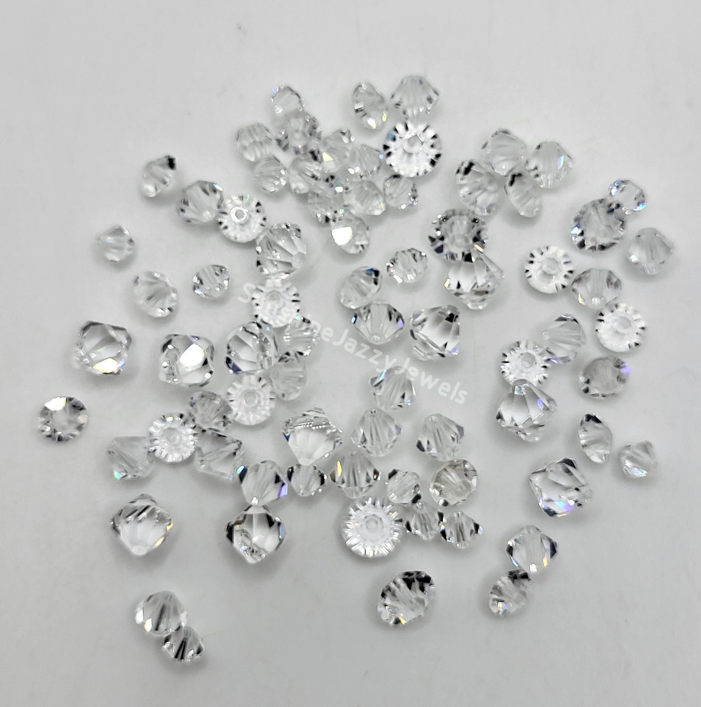 CLEARANCE MIX!  75pc Swarovski Crystal Clear Mixed Shapes; Bicone, Spacers