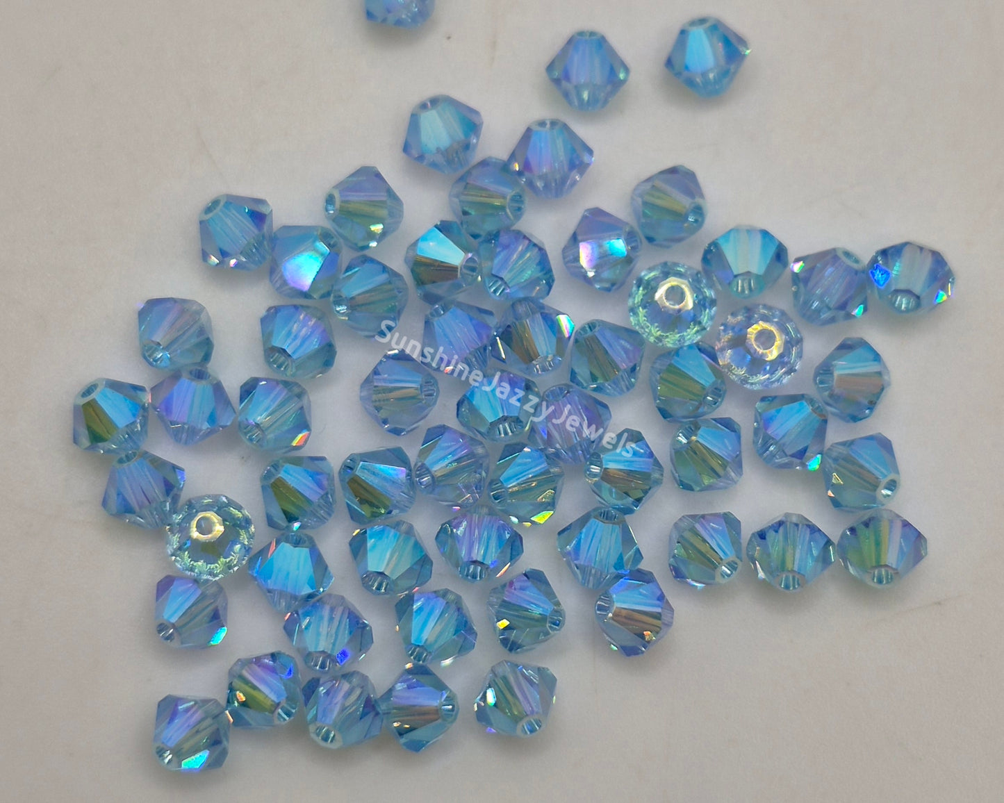 #5328 - Swarovski Crystal 4mm AB2X Bicone Beads; 24pc per pack