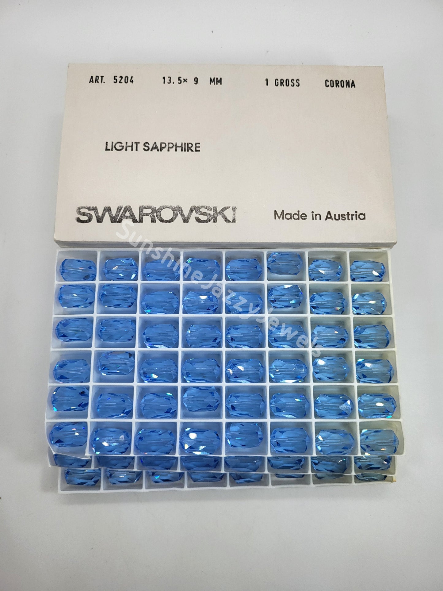 #5204 - Factory Pack Swarovski Crystal Light Sapphire 13.5x9mm Barrel Beads; 144pc